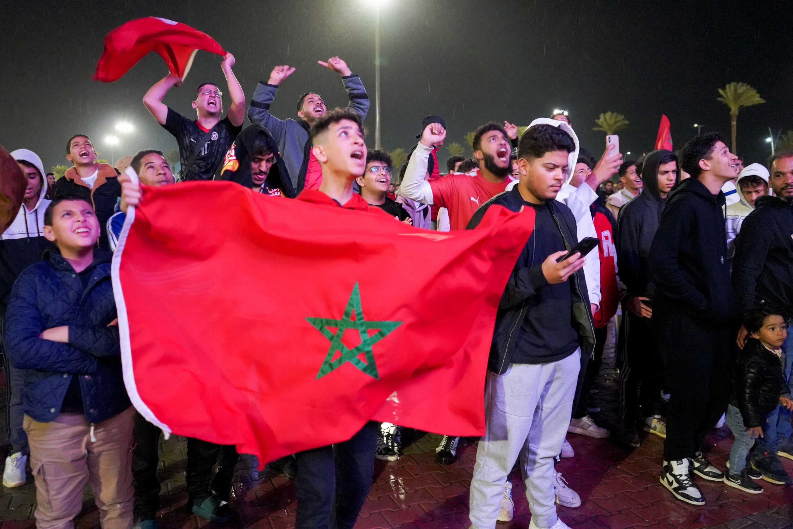 Soccer Football - FIFA World Cup Qatar 2022 - Fans in Tripoli watch Morocco v Portugal - Tripoli , Libya - December 10, 2022 Fans react as they watch the match inside Martyrs' Square REUTERS