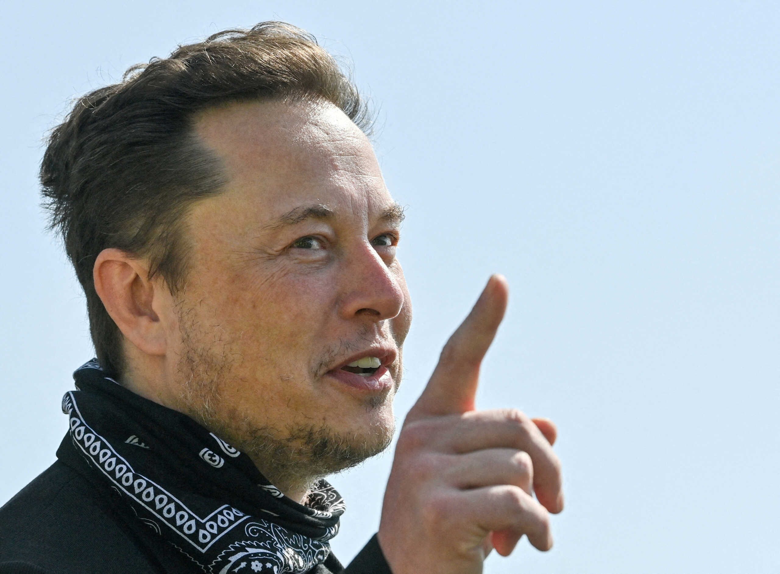 FILE PHOTO: Tesla CEO Elon Musk gestures as he visits the construction site of Tesla's Gigafactory in Gruenheide near Berlin, Germany, August 13, 2021. Patrick Pleul