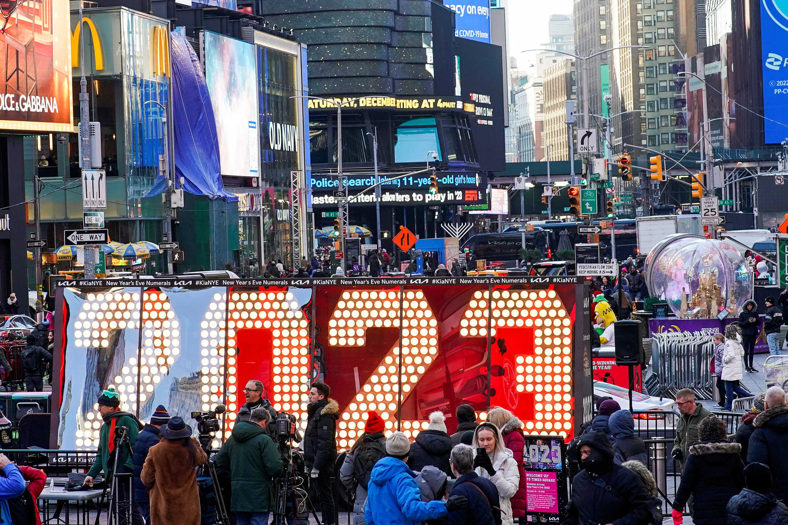 People take a look at the giant, seven-foot-tall numerals for "2023", as it arrives for the December 31 Times New Year's Eve celebrations, at Times Square in New York City, U.S., December 20, 2022. REUTERS