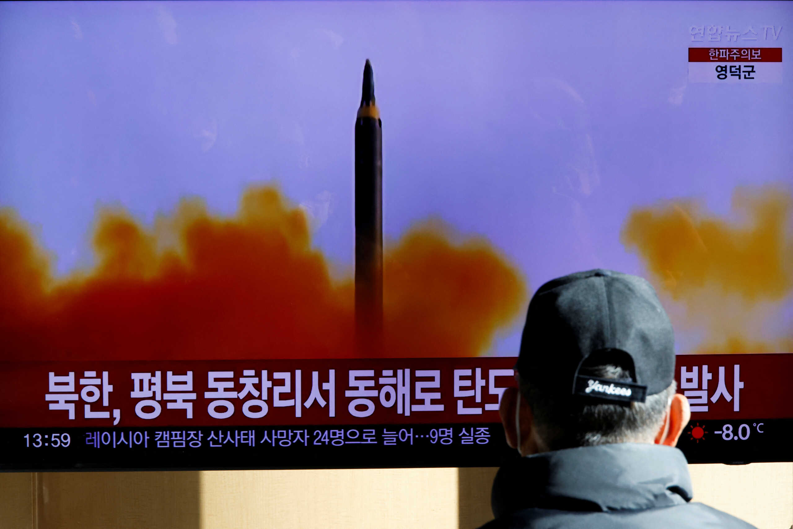 A man watches a TV broadcasting a news report on North Korea firing a ballistic missile off its east coast, in Seoul, South Korea, December 18, 2022.  REUTERS