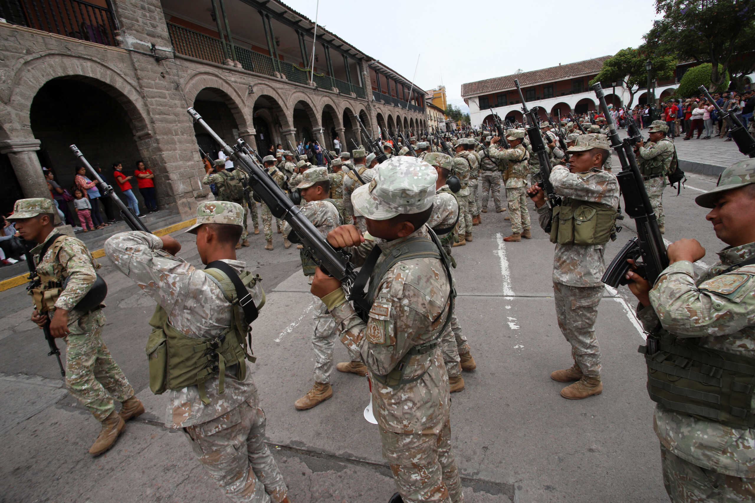 Soldiers take their weapons after they arrived as reinforcements amid violent protests following the ousting and arrest of former President Pedro Castillo, in Ayacucho, Peru December 15, 2022. REUTERS