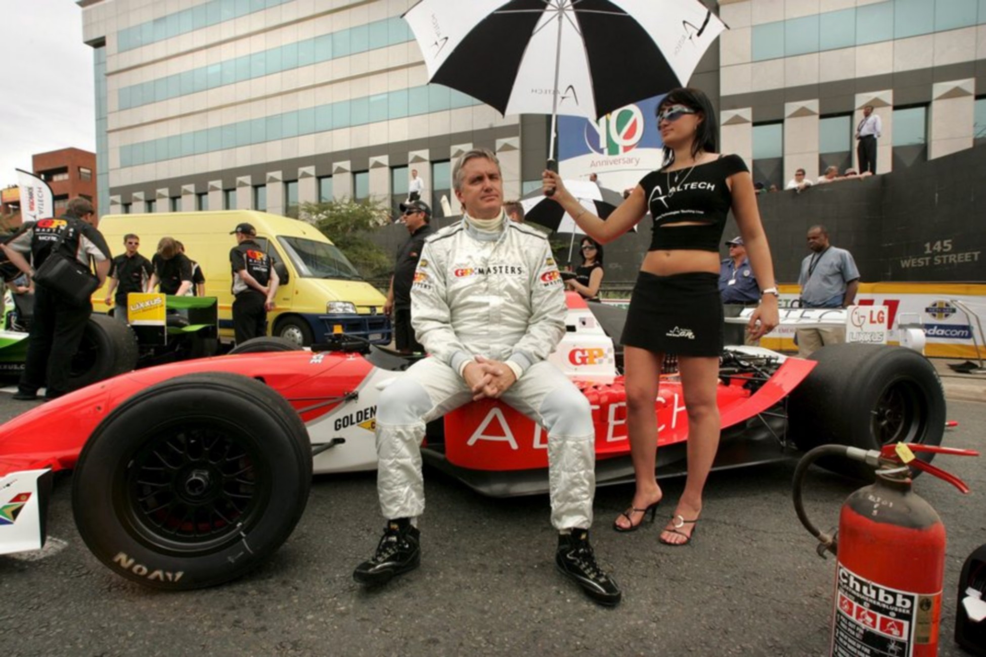 epa00571632 Former F1 driver, France's Patrick Tambay about to take his GP Masters car around the streets of Sandton, Johannesburg, Thursday 10 November 2005. Sunday 13 November sees the inaugural GP Masters to be raced at Kyalami race course and involves past racers including Alain Prost, Riccardo Patrese,Partick Tombay and Emerson Fittipaldi racing in a global series.  EPA