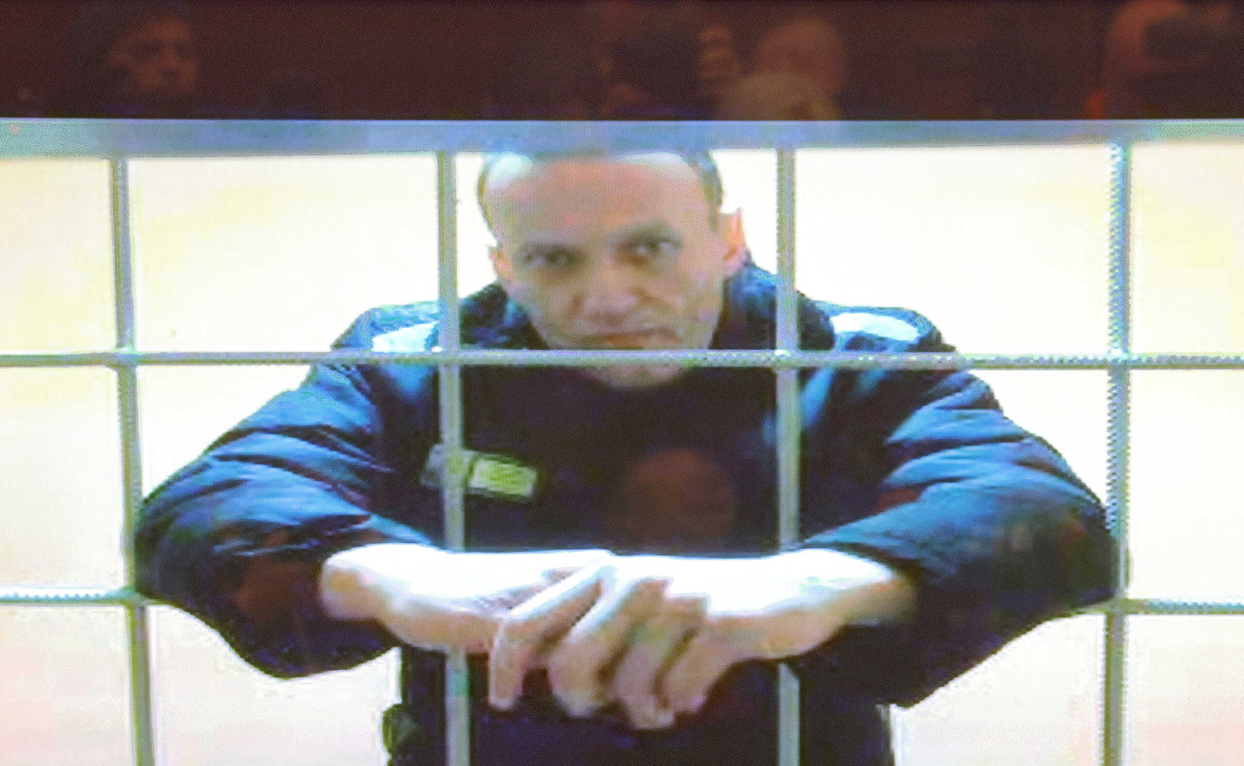 FILE PHOTO: Russian opposition leader Alexei Navalny is seen on a screen via a video link from the IK-2 corrective penal colony in Pokrov during a court hearing to consider an appeal against his prison sentence in Moscow, Russia, May 24, 2022. REUTERS