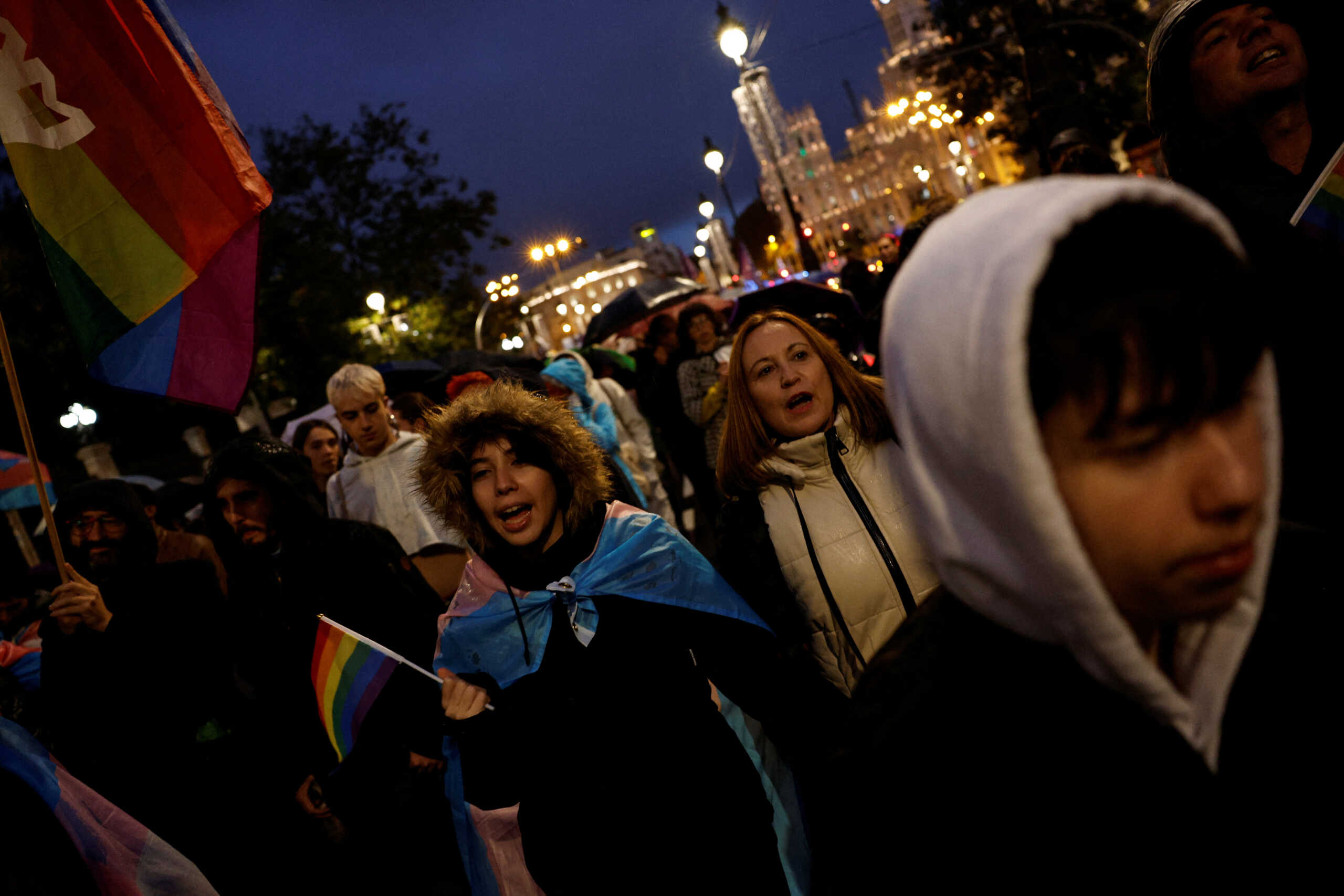 Aslan Galan, a Spanish 14-year-old transgender boy, together with his parents Beatriz Moya and Jose Manuel Galan and sister Ariadna (not pictured), takes part in a protest to demand that the government stops delaying the passing of a law to make it easier for people to self-identify as transgender in Madrid, Spain, November 12, 2022. "We knew there was something going on. He has always been a very good student, but his grades were dropping, he was moody and keeping to himself. At first we thought he might be a lesbian and was afraid to come out, but he wouldn't tell us. He confided to his sister first and a year later he told us he was transgender", Aslan's mother Beatriz Moya says. REUTERS