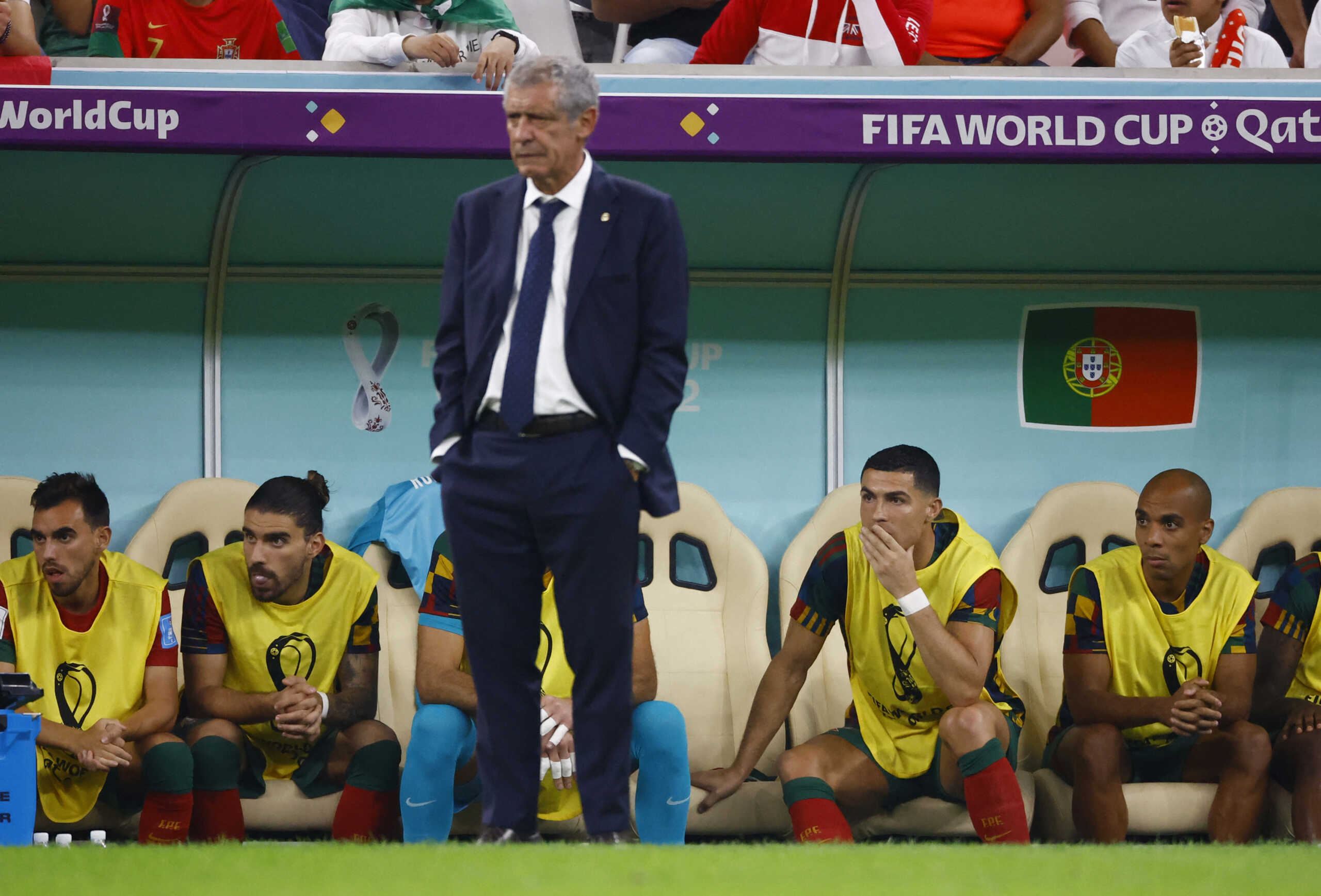 Soccer Football - FIFA World Cup Qatar 2022 - Round of 16 - Portugal v Switzerland - Lusail Stadium, Lusail, Qatar - December 6, 2022 Portugal coach Fernando Santos reacts  as Cristiano Ronaldo looks on from the substitute bench REUTERS