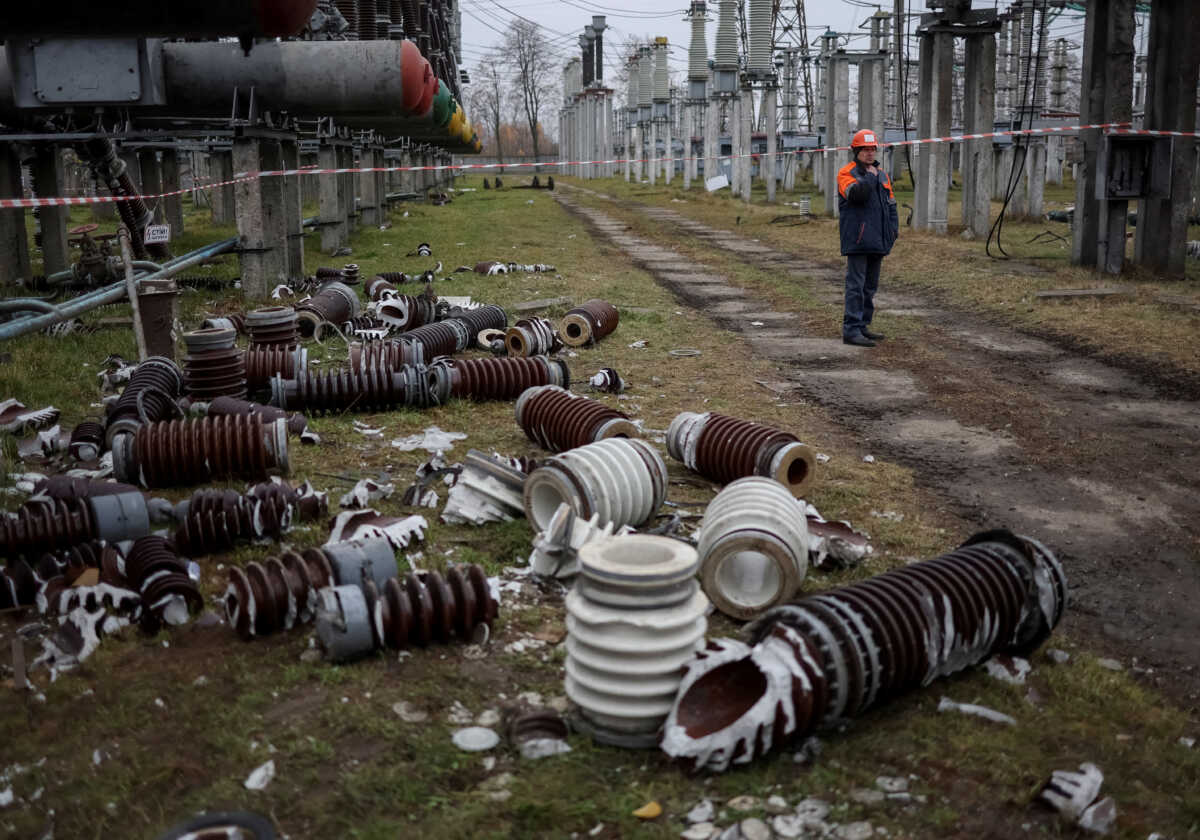FILE PHOTO: A worker is seen at a high-voltage substation of Ukrenergo damaged by Russian military strike, as Russia's attack on Ukraine continues, in the central region of Ukraine November 10, 2022.  REUTERS