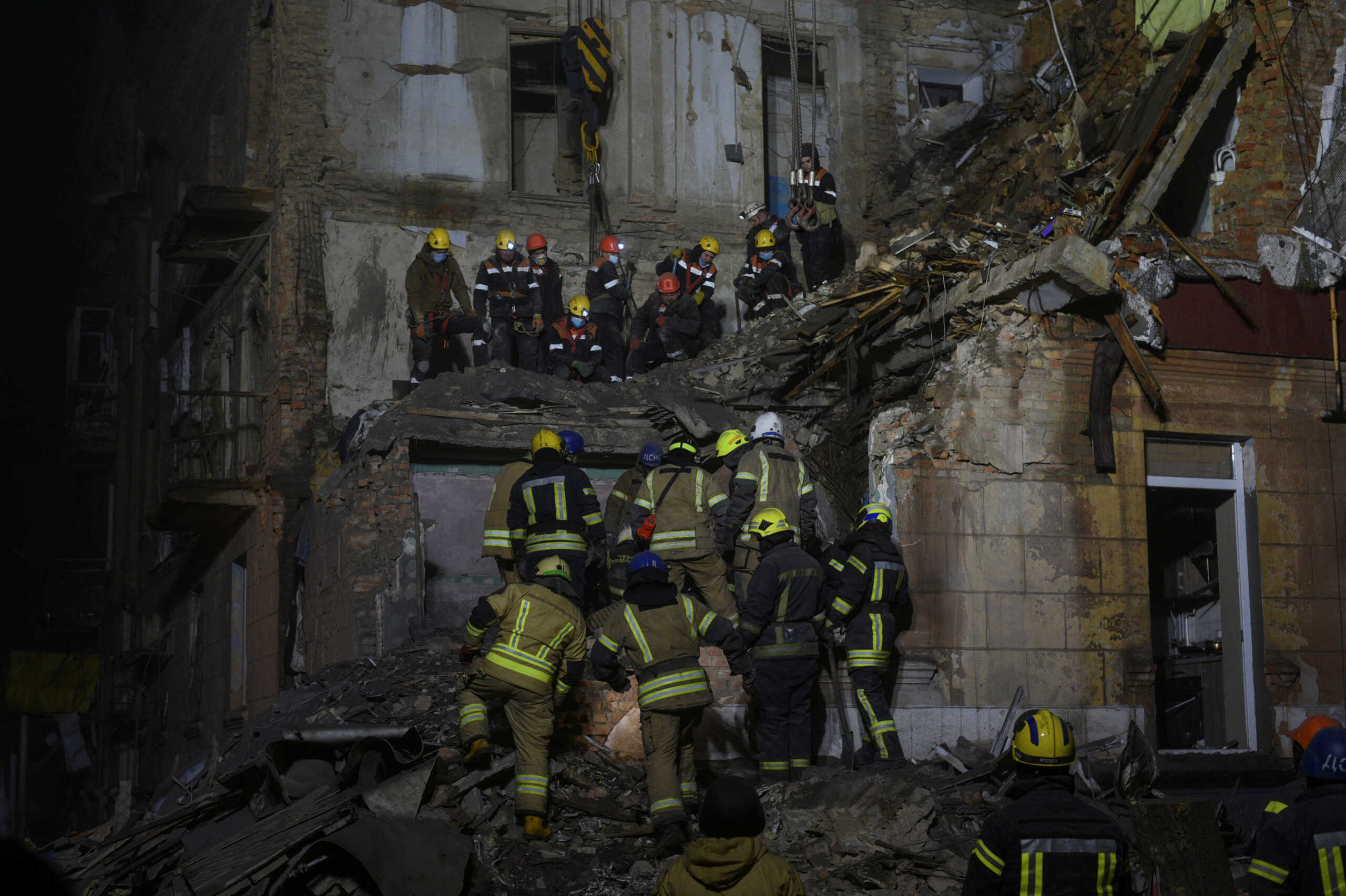 Rescuers work at the site of a residential building damaged by a Russian missile, amid Russia's attack on Ukraine, in Kryvyi Rih, Ukraine December 16, 2022. REUTERS