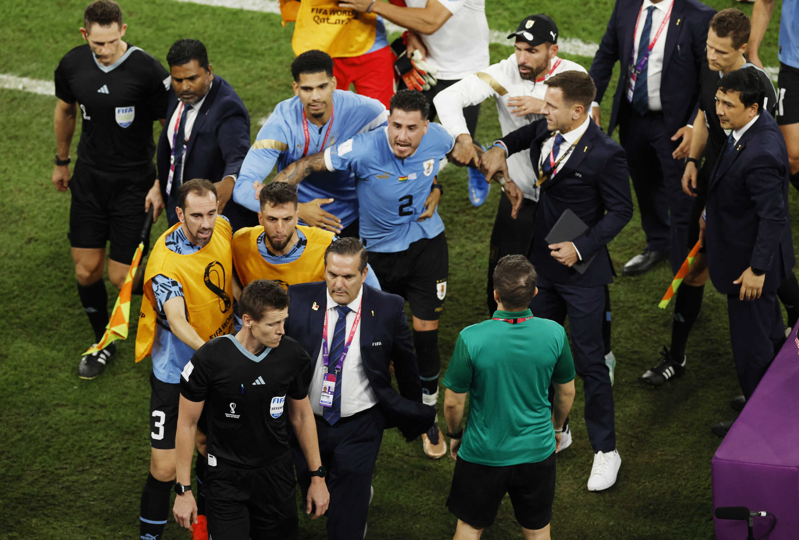 Soccer Football - FIFA World Cup Qatar 2022 - Group H - Ghana v Uruguay - Al Janoub Stadium, Al Wakrah, Qatar - December 2, 2022 Uruguay players remonstrate with the referee Daniel Siebert after the match REUTERS