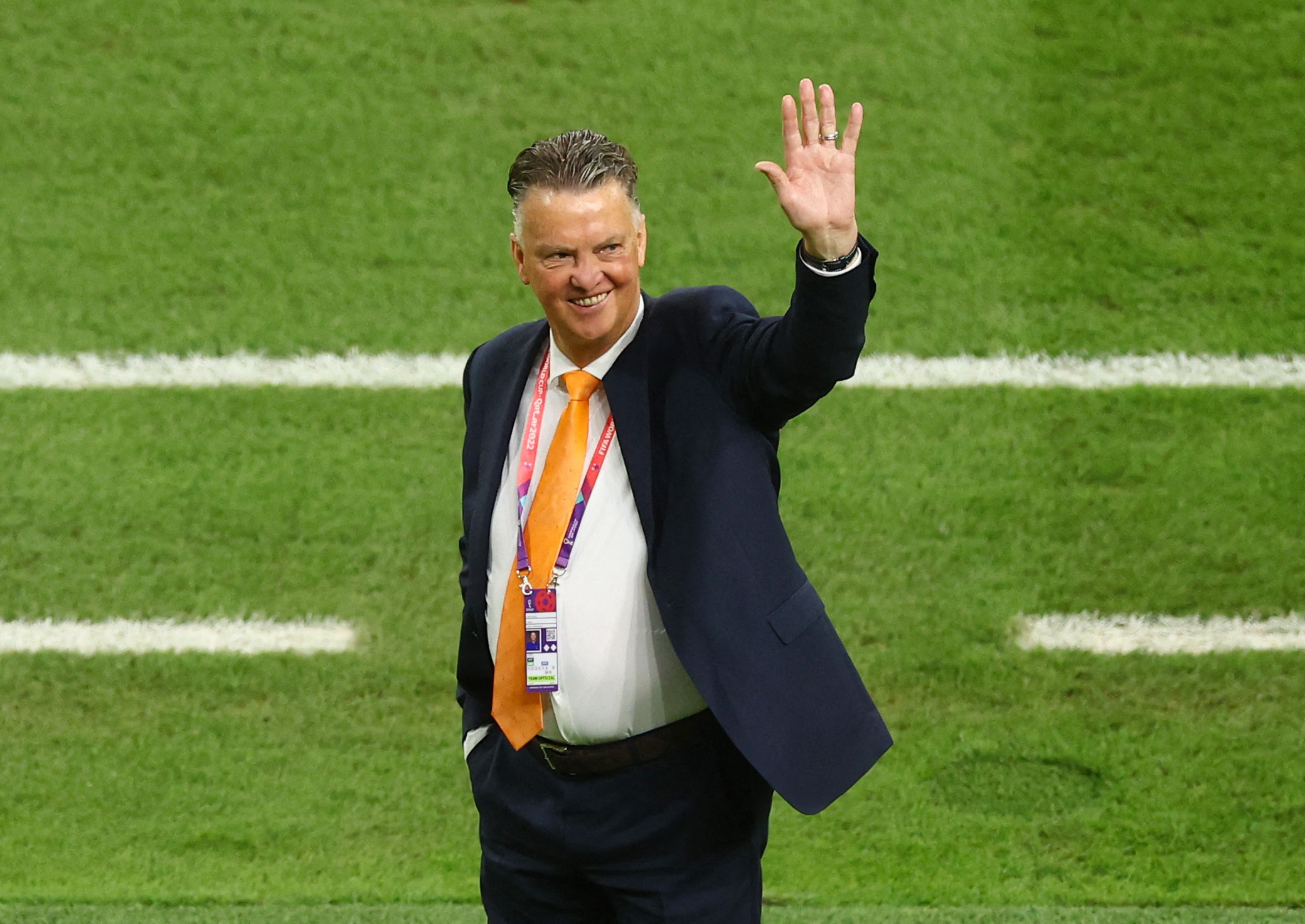 Soccer Football - FIFA World Cup Qatar 2022 - Round of 16 - Netherlands v United States - Khalifa International Stadium, Doha, Qatar - December 3, 2022 Netherlands coach Louis van Gaal waves to fans during the warm up before the match REUTERS