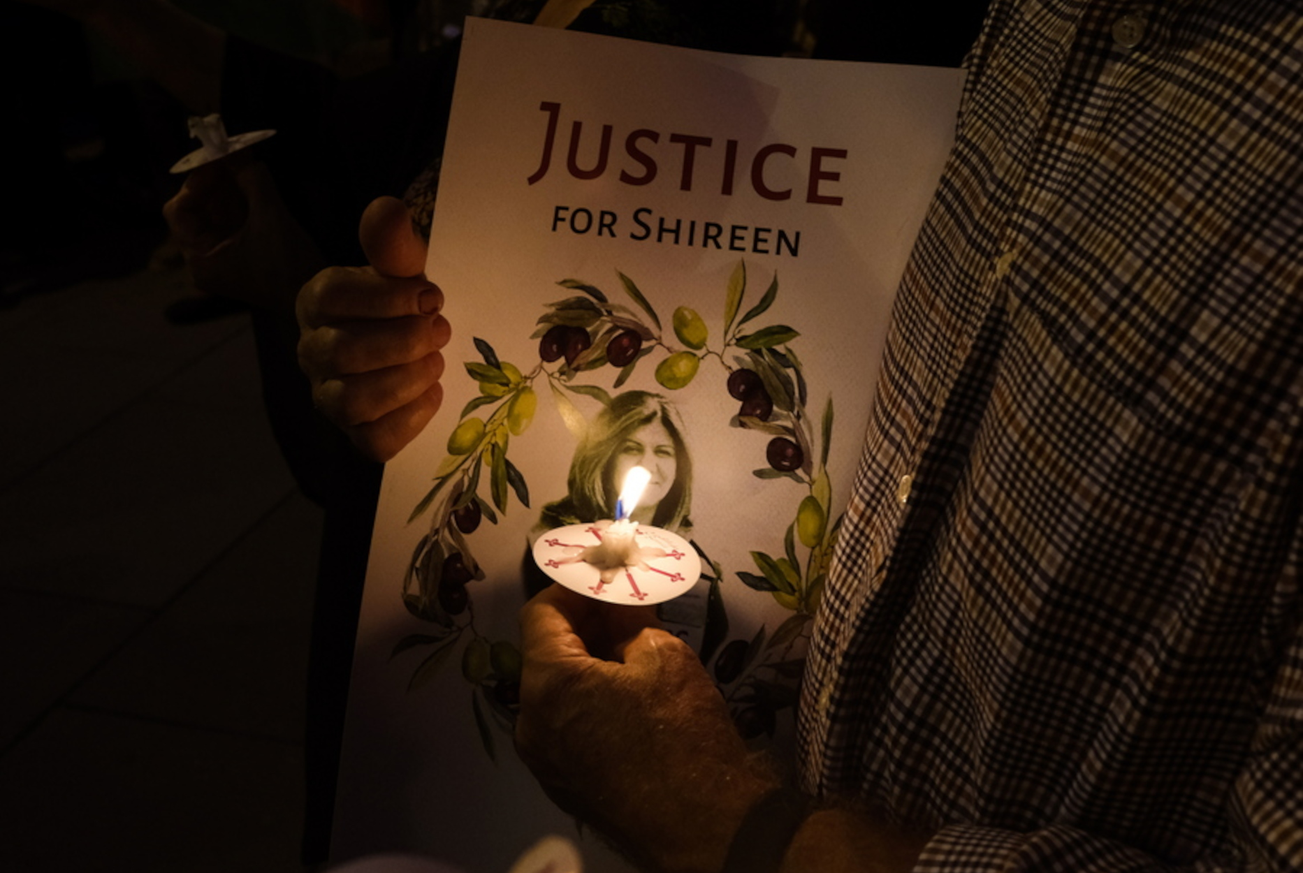 epaselect epa09954218 People attend a candlelight vigil to honor the slain al-Jazeera Journalist Shireen Abu Akleh, in Washington, DC, USA, 17 May 2022. Al Jazeera journalist Shireen Abu Akleh was killed on 11 May 2022 during a raid by Israeli forces in the West Bank town of Jenin.  EPA