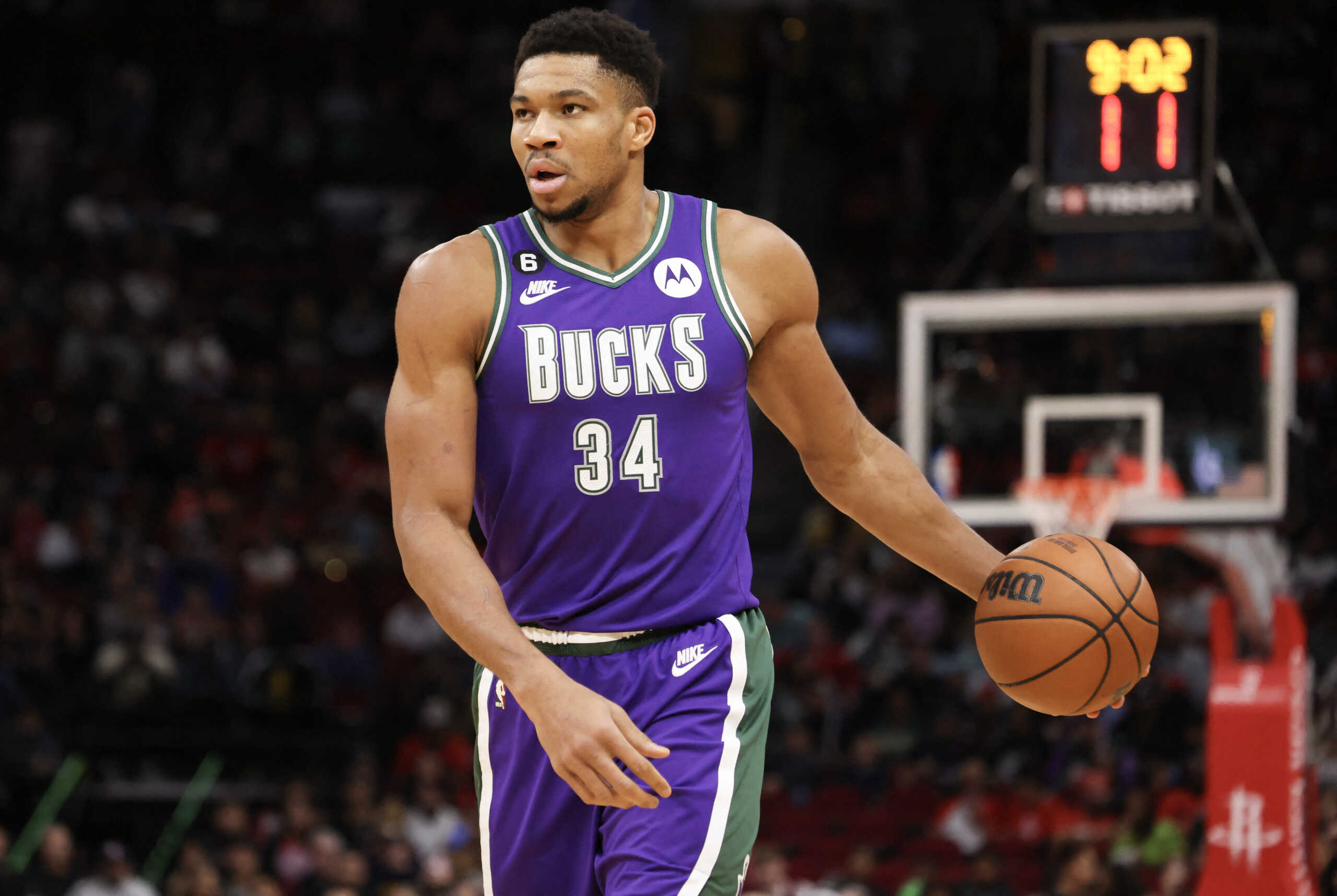 Dec 11, 2022; Houston, Texas, USA; Milwaukee Bucks forward Giannis Antetokounmpo (34) dribbles against the Houston Rockets  in the first quarter at Toyota Center. Mandatory Credit: Thomas B. Shea-USA TODAY Sports