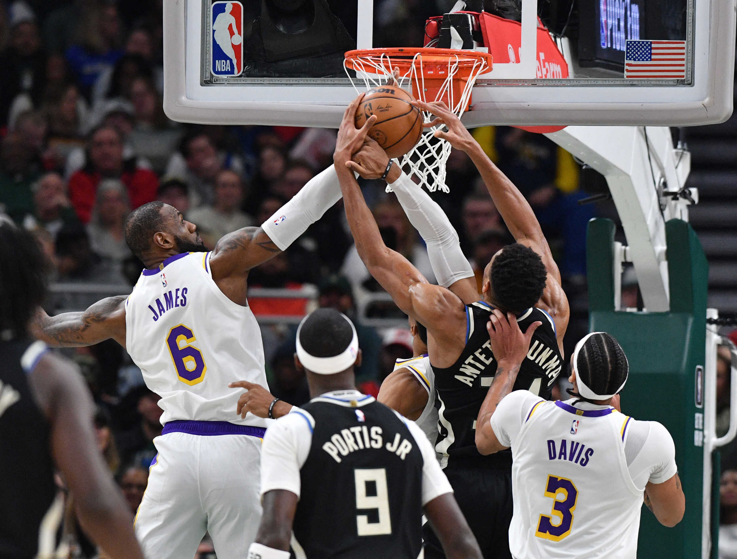 Dec 2, 2022; Milwaukee, Wisconsin, USA; Los Angeles Lakers forward LeBron James (6) and Milwaukee Bucks forward Giannis Antetokounmpo (34) battle for a rebound in the third quarter at Fiserv Forum. Mandatory Credit: Michael McLoone-USA TODAY Sports
