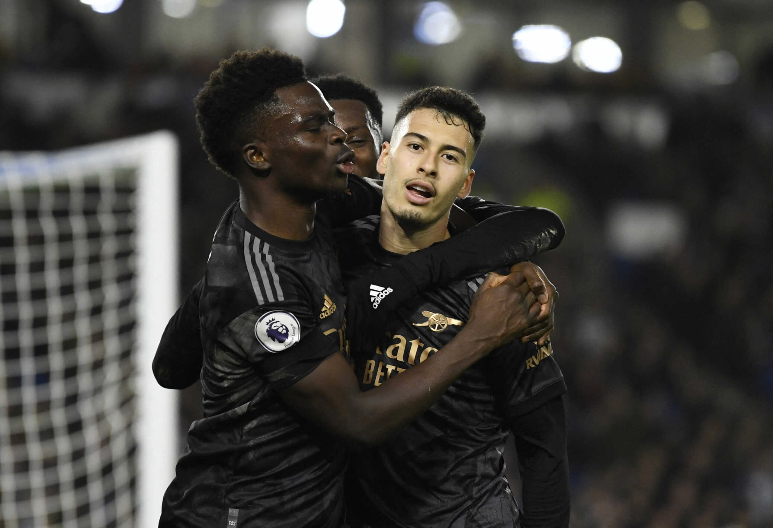 Soccer Football - Premier League - Brighton & Hove Albion v Arsenal - The American Express Community Stadium, Brighton, Britain - December 31, 2022 Arsenal's Gabriel Martinelli celebrates scoring their fourth goal with Eddie Nketiah and Bukayo Saka REUTERS