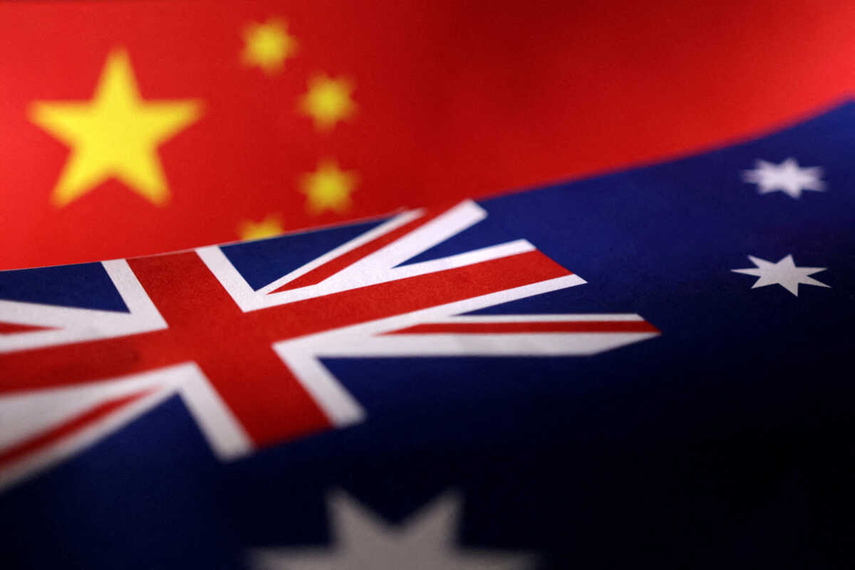 FILE PHOTO: Printed Chinese and Australian flags are seen in this illustration, July 21, 2022. REUTERS