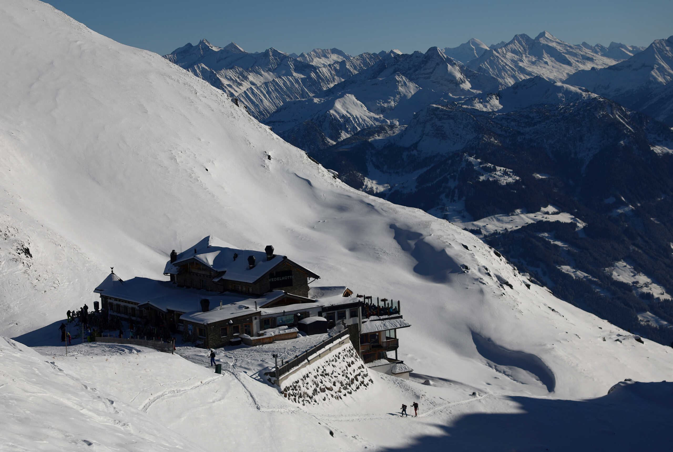 Ski tourers arrive at an Alpine lodge in the Tyrolean ski resort of Hochzillertal near Kaltenbach, Austria December 18, 2022. REUTERS