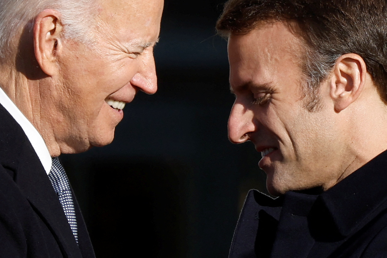 U.S. President Joe Biden greets French President Emmanuel Macron during an official State Arrival Ceremony on the South Lawn at the White House in Washington, U.S., December 1, 2022. REUTERS