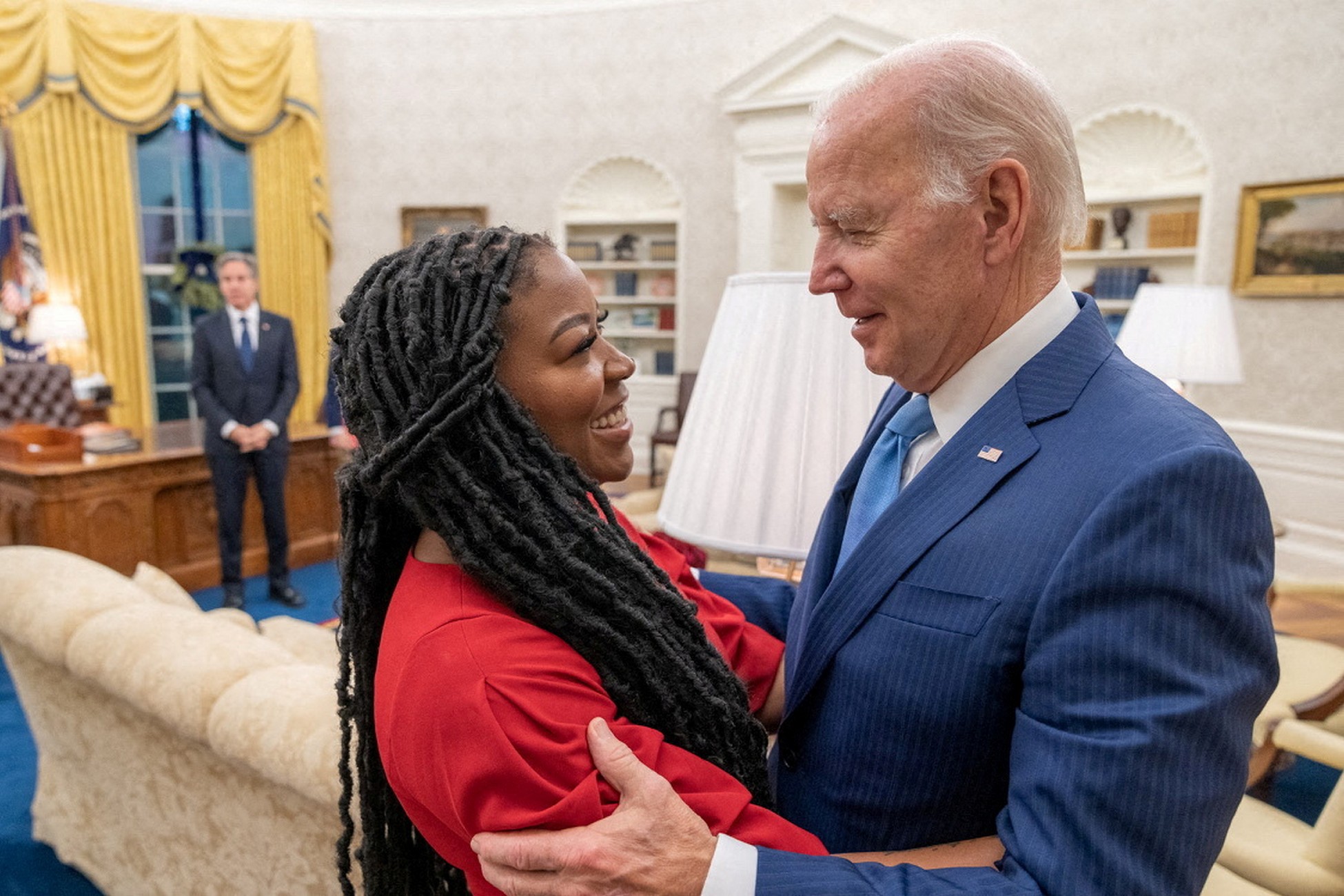 U.S. President Joe Biden hugs Cherelle Griner in this White House handout photo taken in the Oval Office, after the release of her wife, WNBA basketball star Brittney Griner by Russia, as U.S. Secretary of State Antony Blinken looks on at the White House in Washington, U.S. December 8, 2022.   The White House