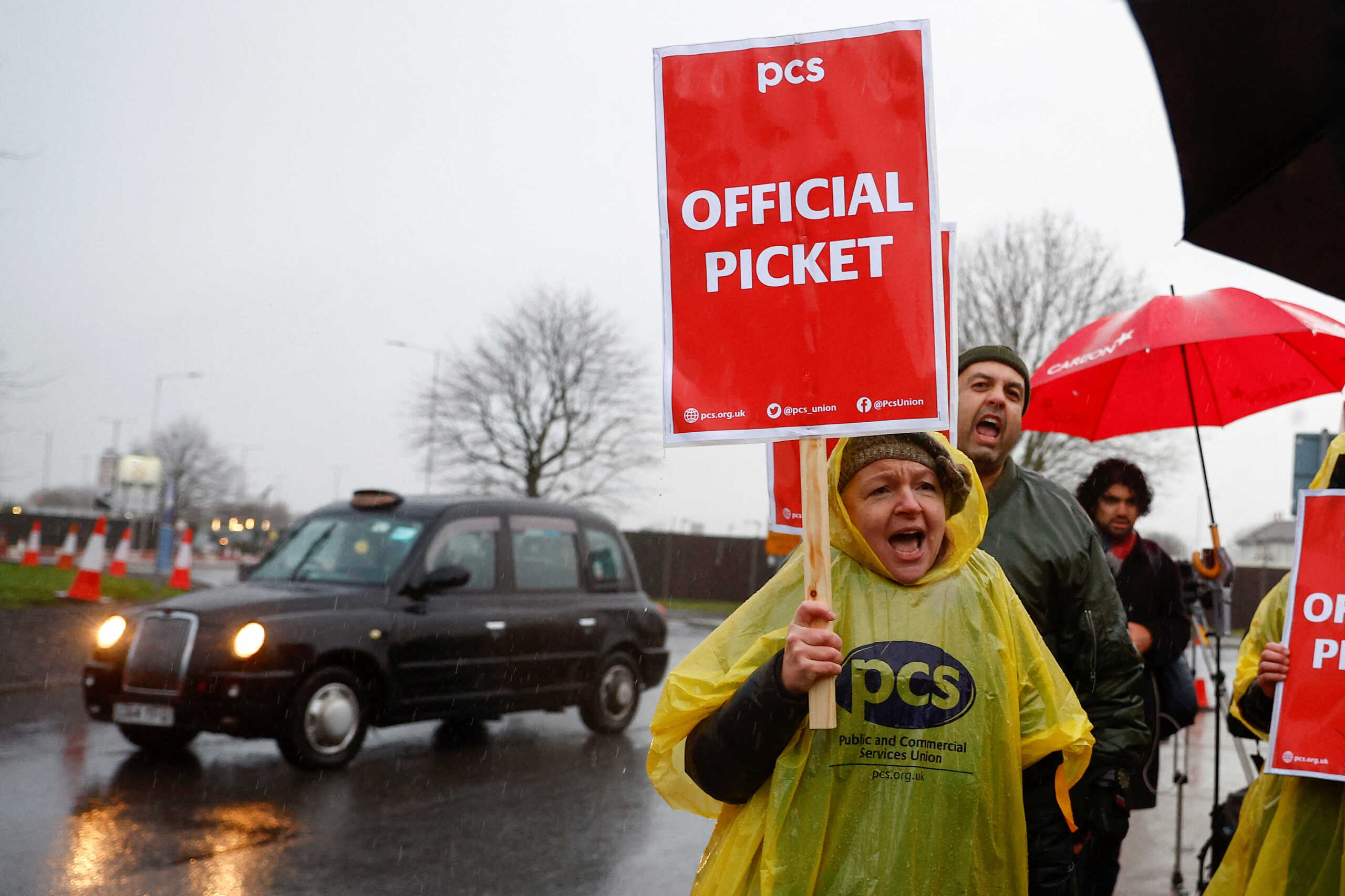 Members of the Public and Commercial Services (PCS) Union take part in a border force workers strike action near Heathrow Airport, in London, Britain December 23, 2022. REUTERS
