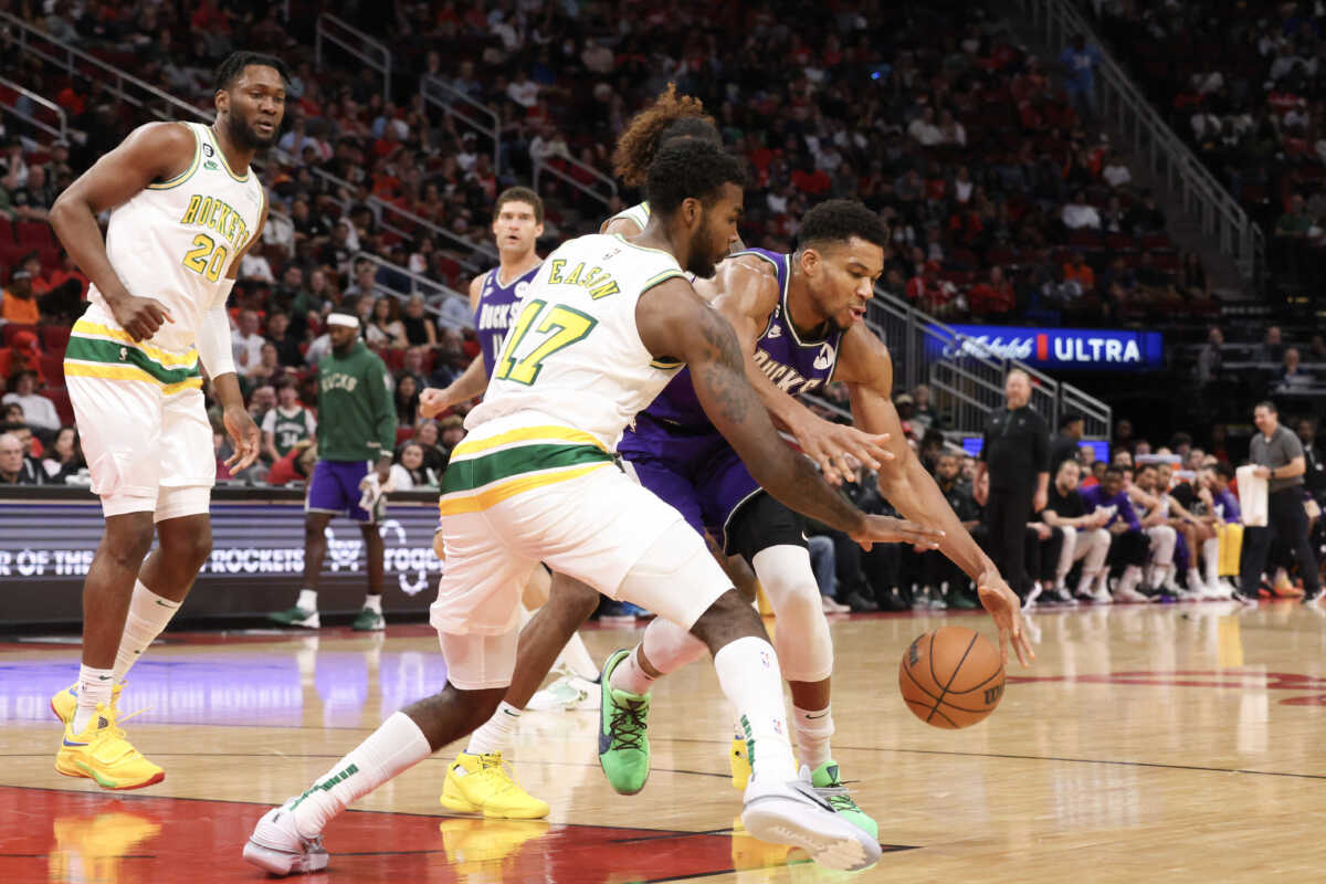 Dec 11, 2022; Houston, Texas, USA; Houston Rockets forward Tari Eason (17) steals the ball from from Milwaukee Bucks forward Giannis Antetokounmpo (34) in the second quarter at Toyota Center. Mandatory Credit: Thomas B. Shea-USA TODAY Sports