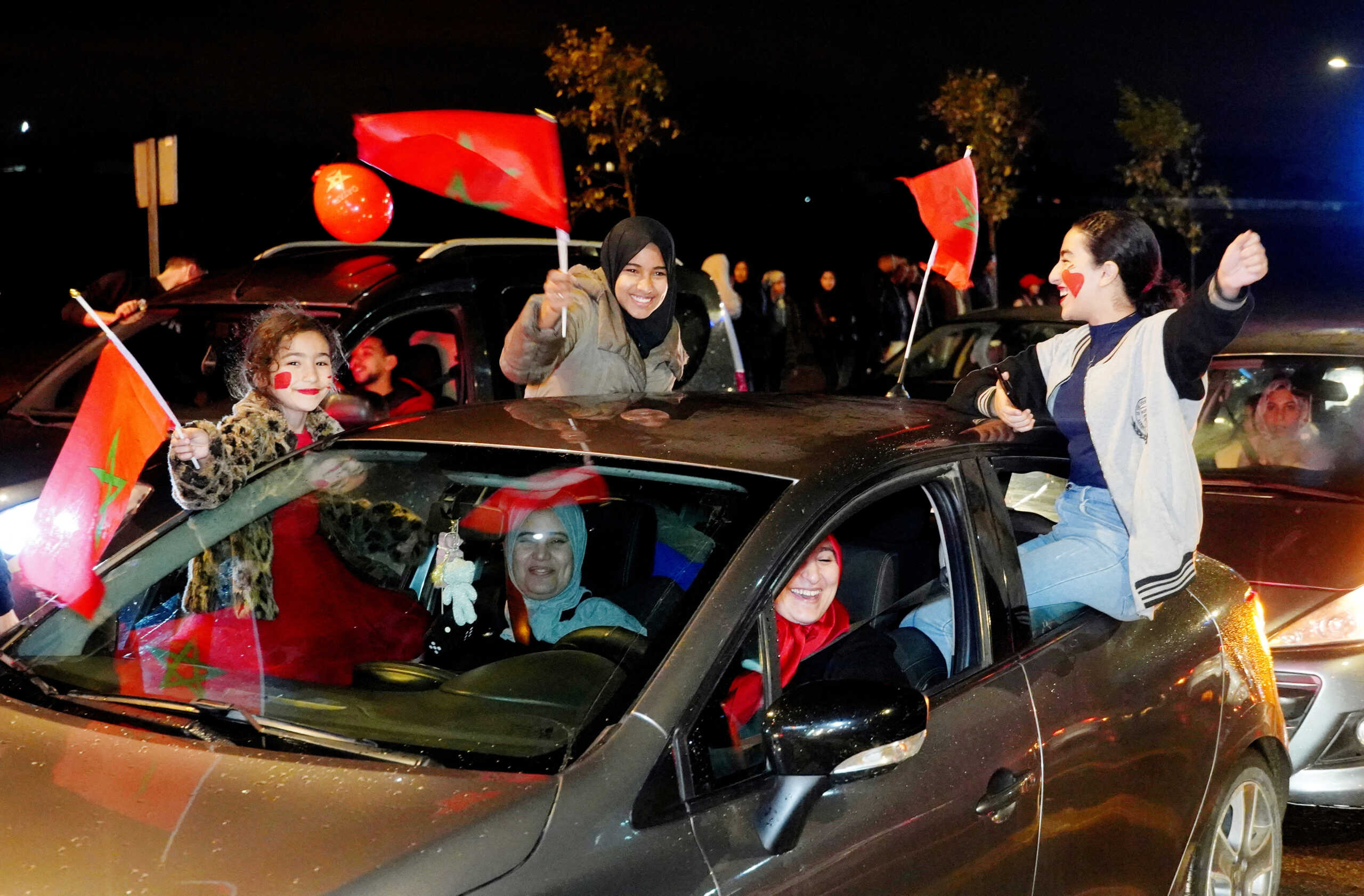 Soccer Football - FIFA World Cup Qatar 2022 - Morocco fans in Casablanca celebrate after the Canada v Morocco world cup match - Casablanca, Morocco - December 1, 2022 Morocco fans in Casablanca celebrate in a car after the Canada v Morocco world cup match REUTERS