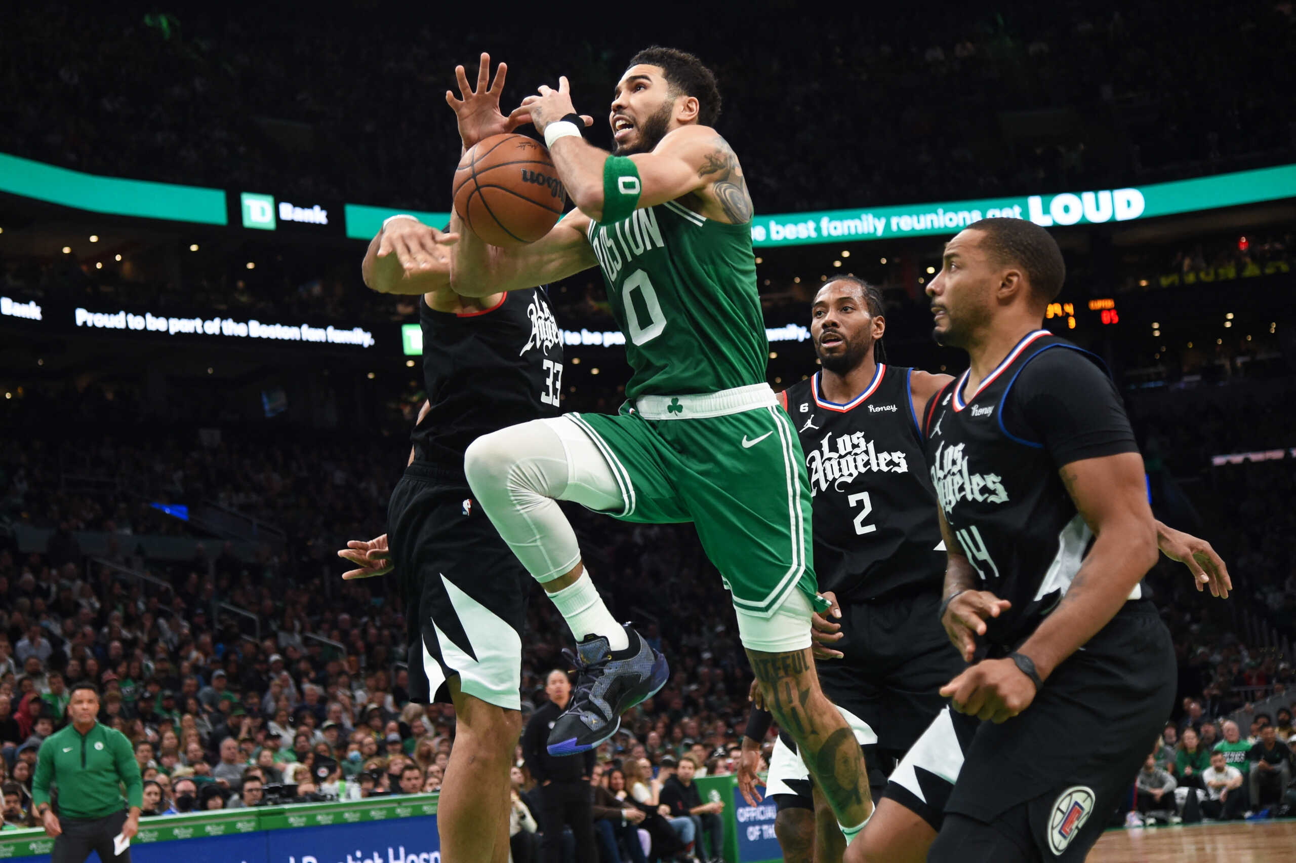 Dec 29, 2022; Boston, Massachusetts, USA;  Boston Celtics forward Jayson Tatum (0) gets fouled by LA Clippers forward Nicolas Batum (33) during the second half at TD Garden. Mandatory Credit: Bob DeChiara-USA TODAY Sports