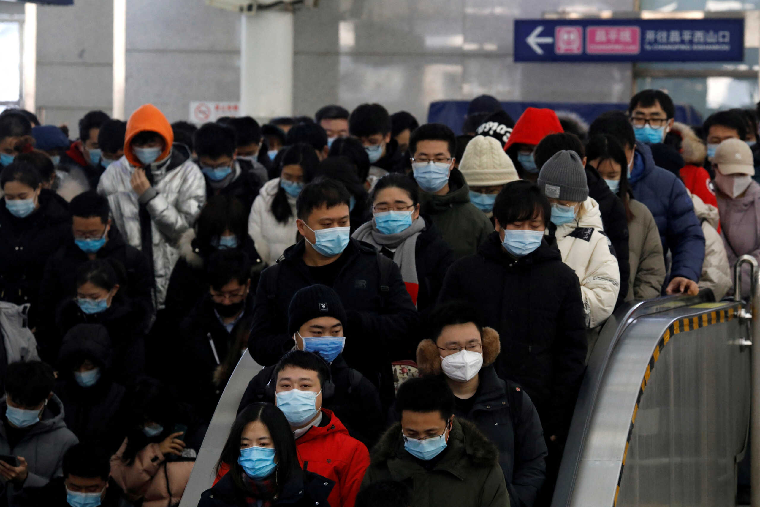 FILE PHOTO: People wearing face masks commute in a subway station during morning rush hour, following the coronavirus disease ( COVID-19) outbreak, in Beijing, China January 20, 2021. REUTERS