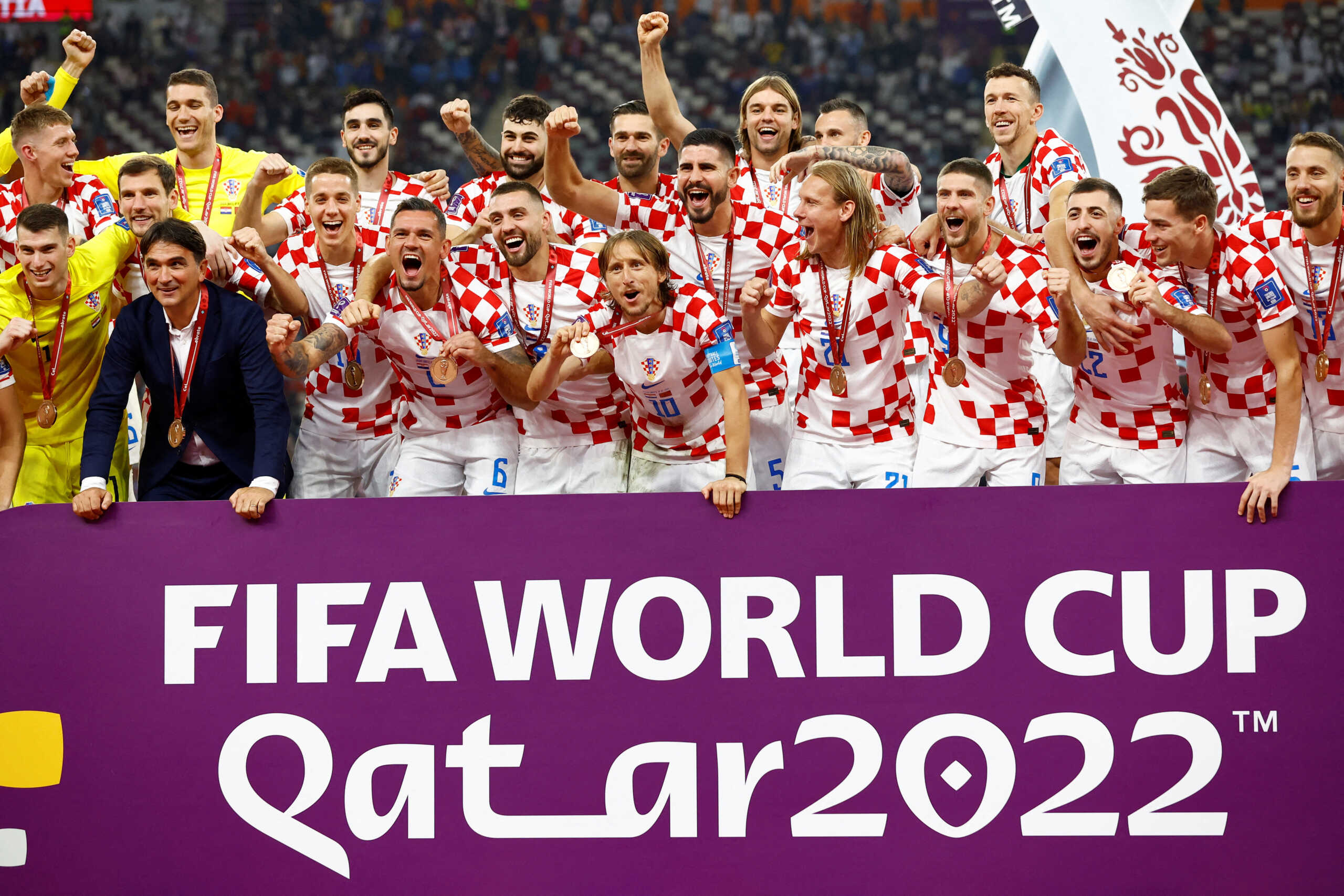 Soccer Football - FIFA World Cup Qatar 2022 - Third-Place Playoff - Croatia v Morocco - Khalifa International Stadium, Doha, Qatar - December 17, 2022 Croatia players celebrate with their medals on stage as they finish in third place REUTERS