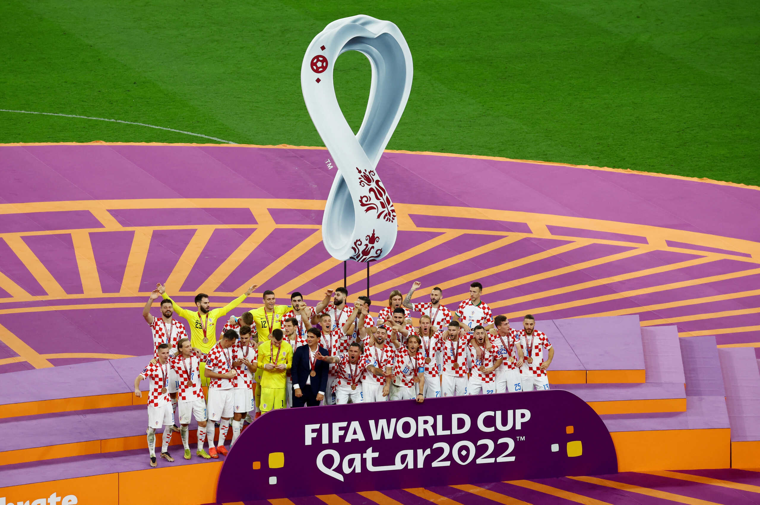 Soccer Football - FIFA World Cup Qatar 2022 - Third-Place Playoff - Croatia v Morocco - Khalifa International Stadium, Doha, Qatar - December 17, 2022 Croatia players and coach Zlatko Dalic celebrate with their medals on stage as they finish in third place REUTERS