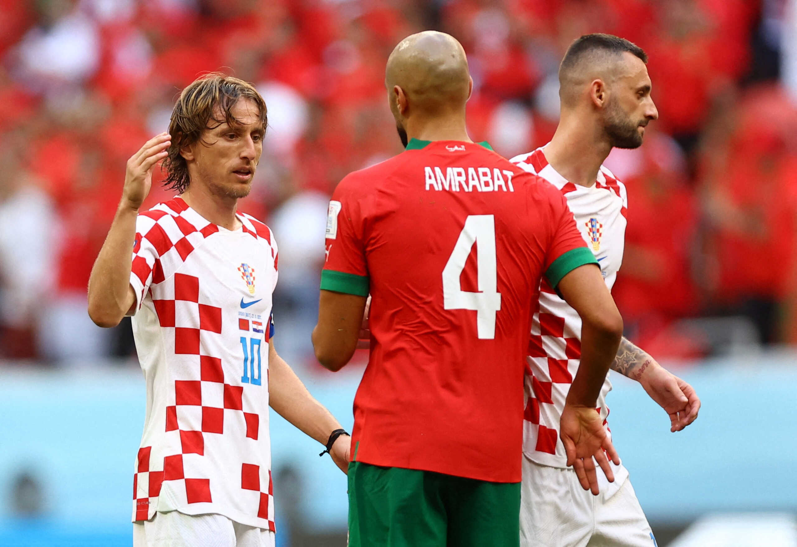 Soccer Football - FIFA World Cup Qatar 2022 - Group F - Morocco v Croatia - Al Bayt Stadium, Al Khor, Qatar - November 23, 2022 Croatia's Luka Modric and Morocco's Sofyan Amrabat after the match REUTERS