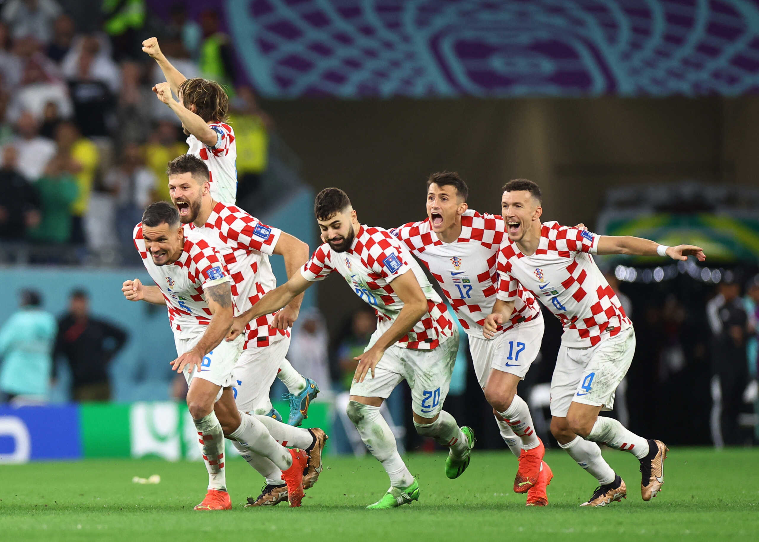 Soccer Football - FIFA World Cup Qatar 2022 - Quarter Final - Croatia v Brazil - Education City Stadium, Doha, Qatar - December 9, 2022 Croatia's players celebrate winning the penalty shootout REUTERS