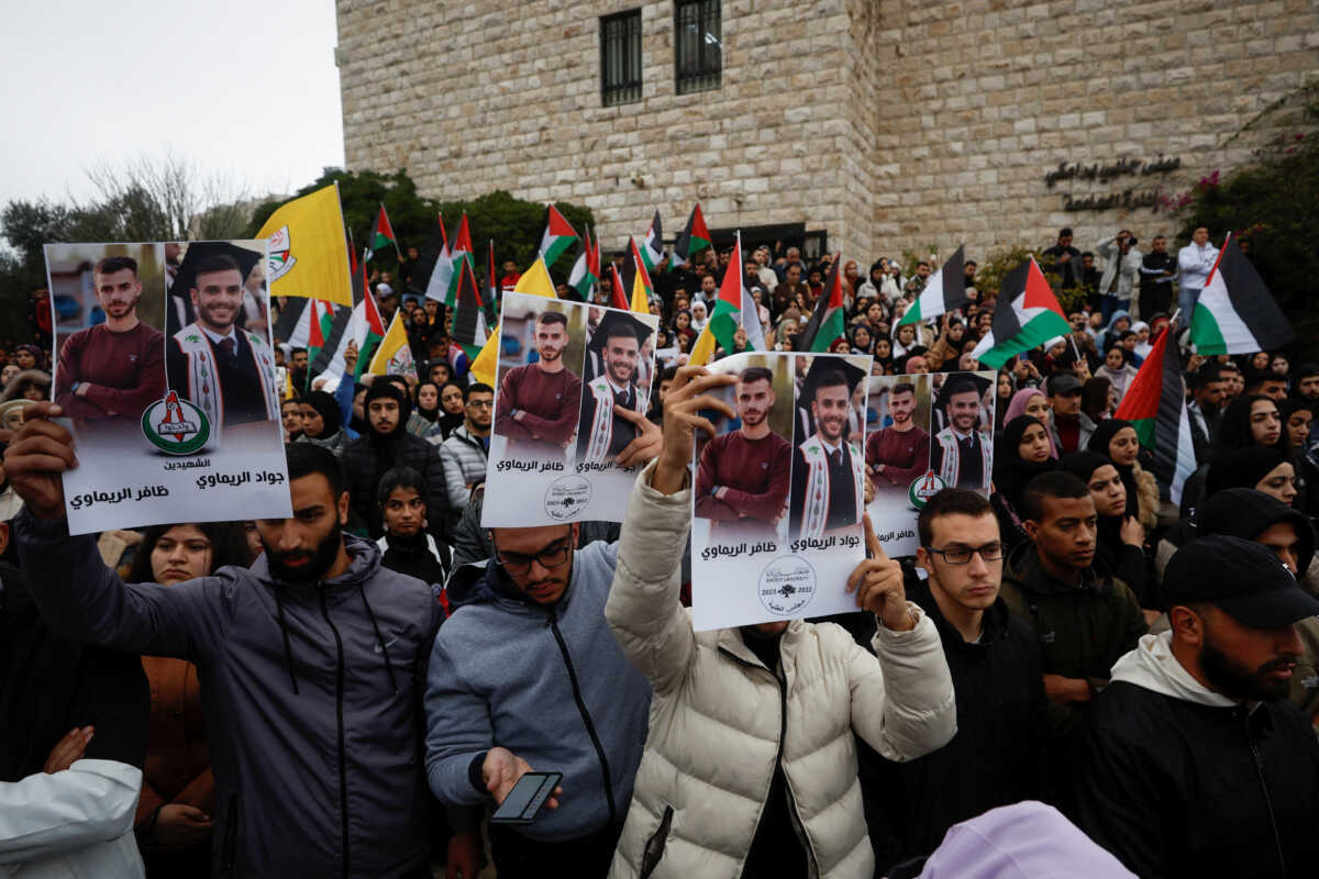 Mourners attend the funeral of two Palestinian brothers Dafer and Jawad Remawi, near Ramallah in the Israeli-occupied West Bank November 29, 2022. REUTERS