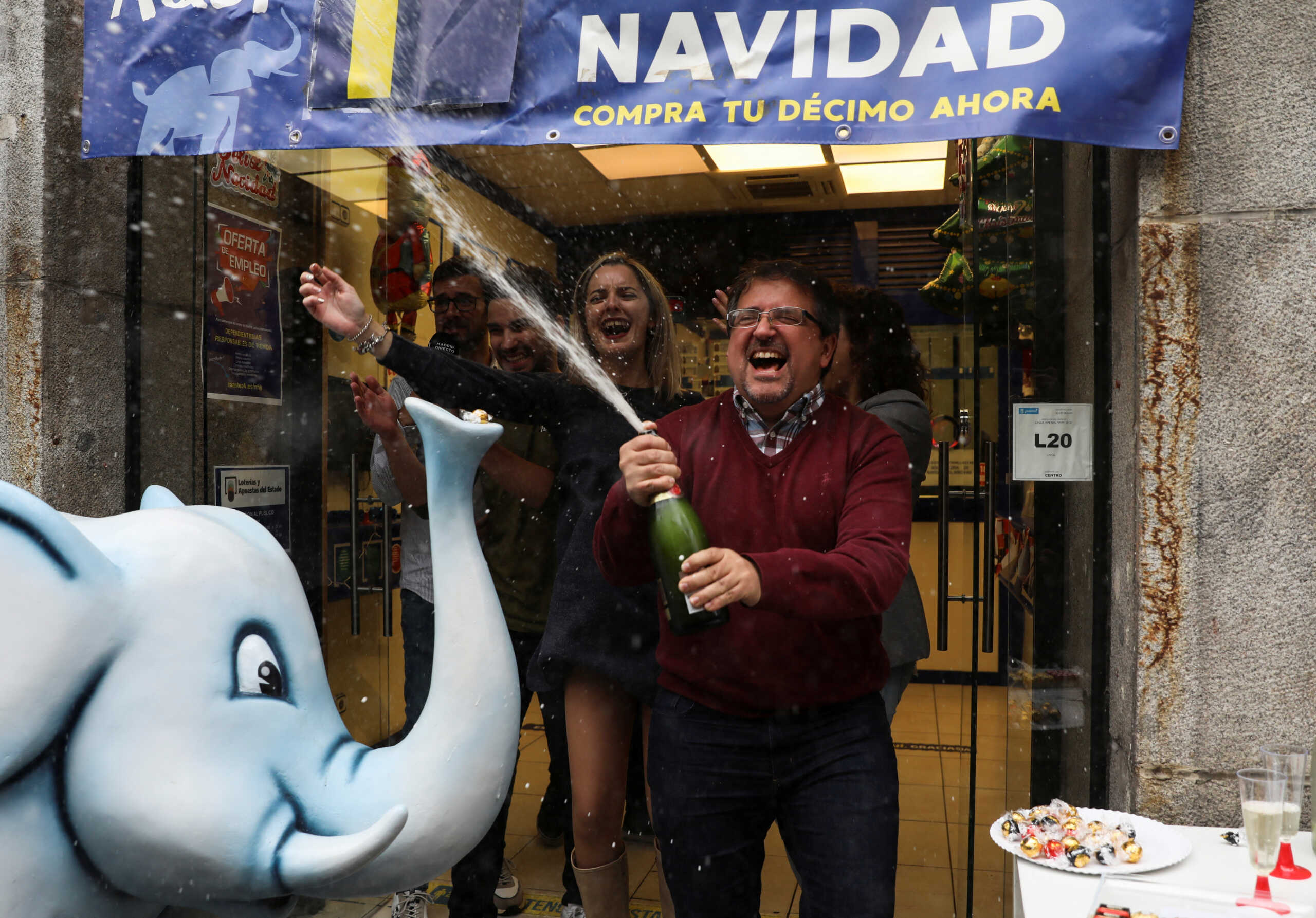 People celebrate winning numbers in Spain's Christmas lottery "El Gordo" (The Fat One), in Madrid, Spain December 22, 2022. REUTERS