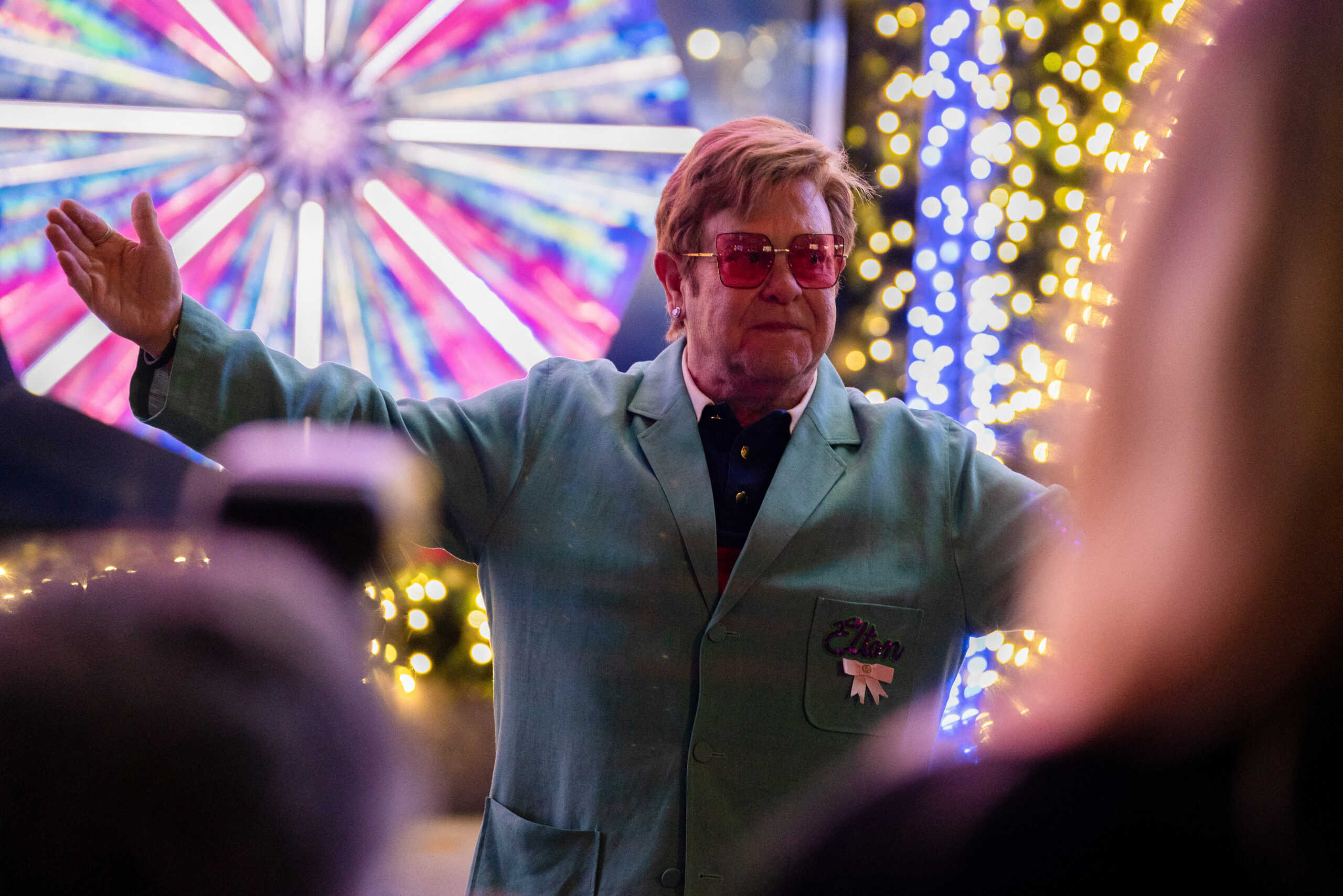 Singer Sir Elton John poses for photos after a performance at  an event to unveil the 2022 holiday windows displays at Saks 5th Avenue department store in midtown Manhattan, in New York City, New York, U.S., November 22, 2022. REUTERS