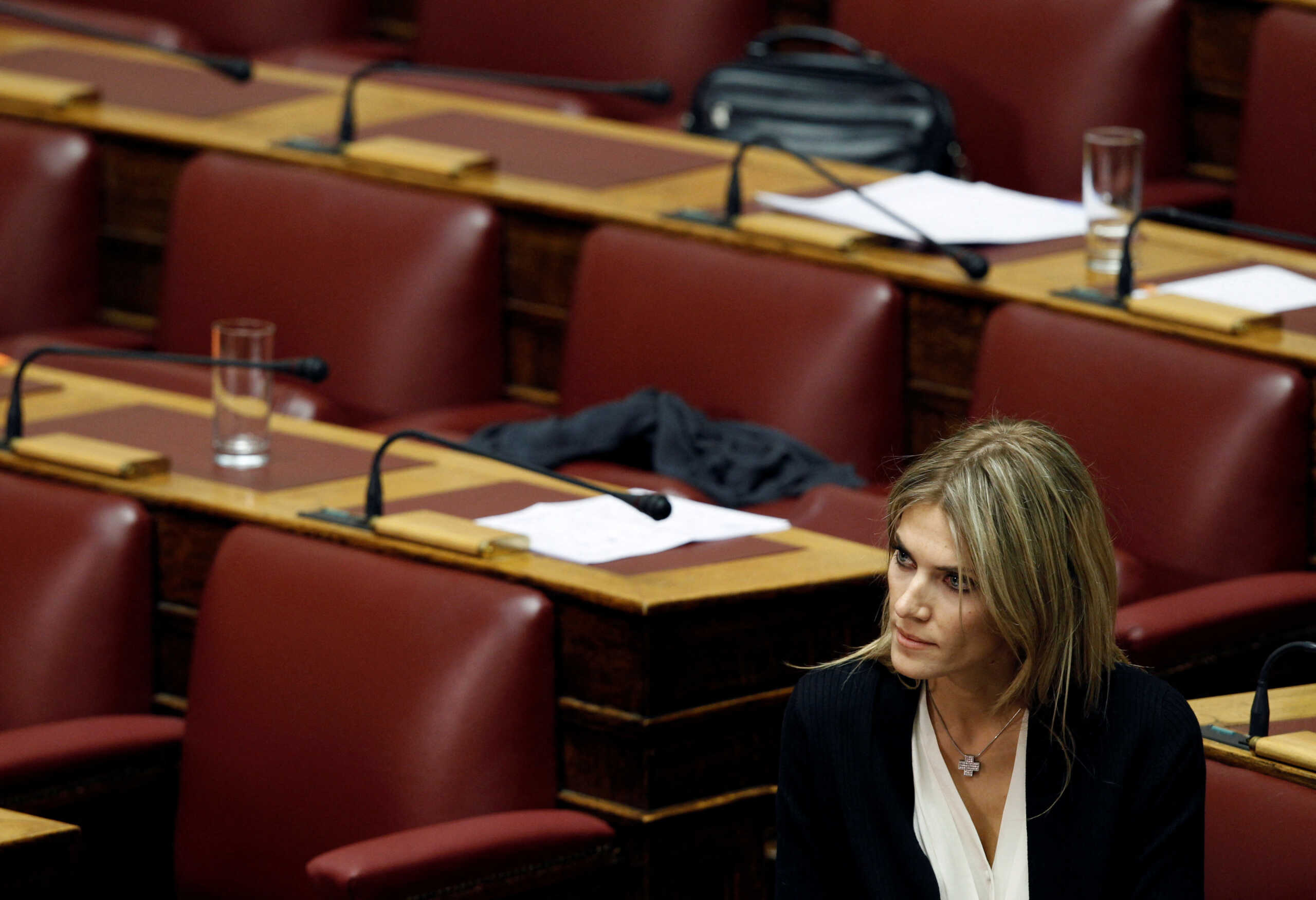 FILE PHOTO: Lawmaker Eva Kaili is seen in the parliament in Athens November 4, 2011, prior to a confidence vote. Kaili had announced she would stay in the party but refused to support the government in the confidence vote expected late on Friday, meaning Prime Minister George Papandreou could count at most on the support of 151 deputies.  REUTERS