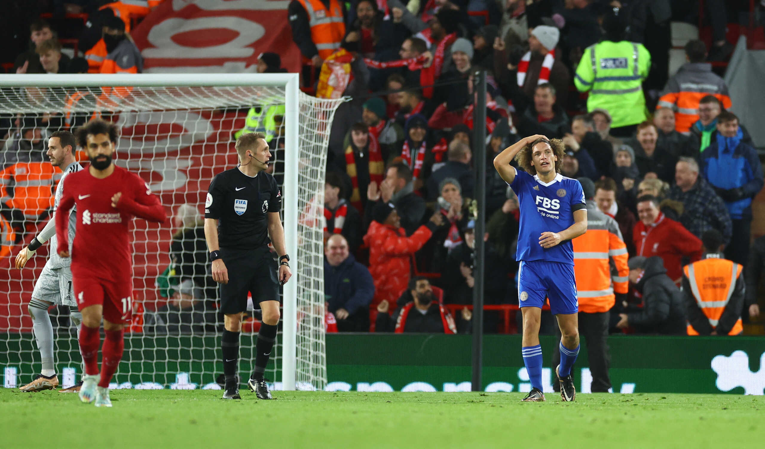 Soccer Football - Premier League - Liverpool v Leicester City - Anfield, Liverpool, Britain - December 30, 2022 Leicester City's Wout Faes reacts after scoring an own goal and Liverpool's first as Danny Ward and referee Craig Pawson look on REUTERS