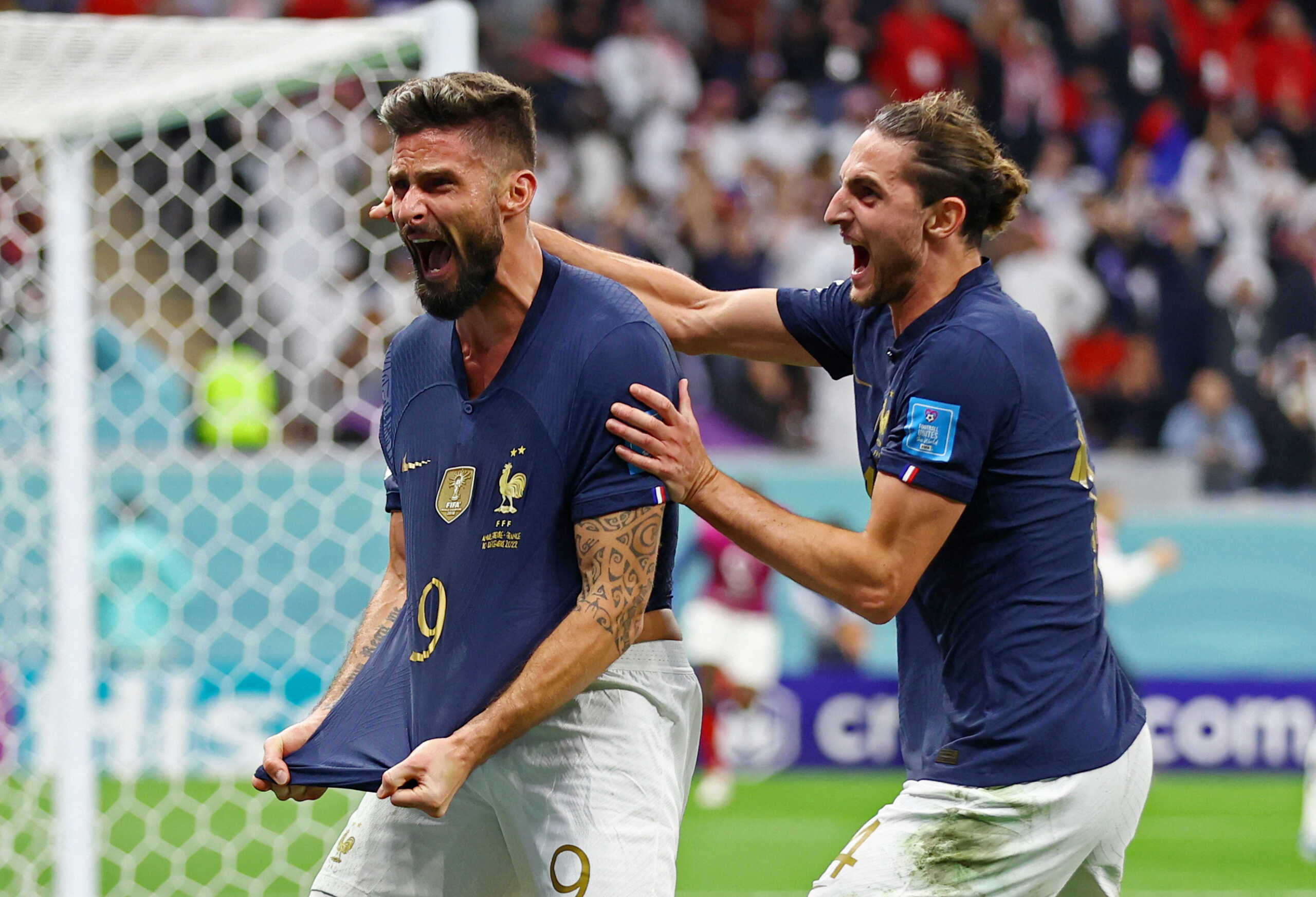 Soccer Football - FIFA World Cup Qatar 2022 - Quarter Final - England v France - Al Bayt Stadium, Al Khor, Qatar - December 10, 2022 France's Olivier Giroud celebrates scoring their second goal with Adrien Rabiot REUTERS