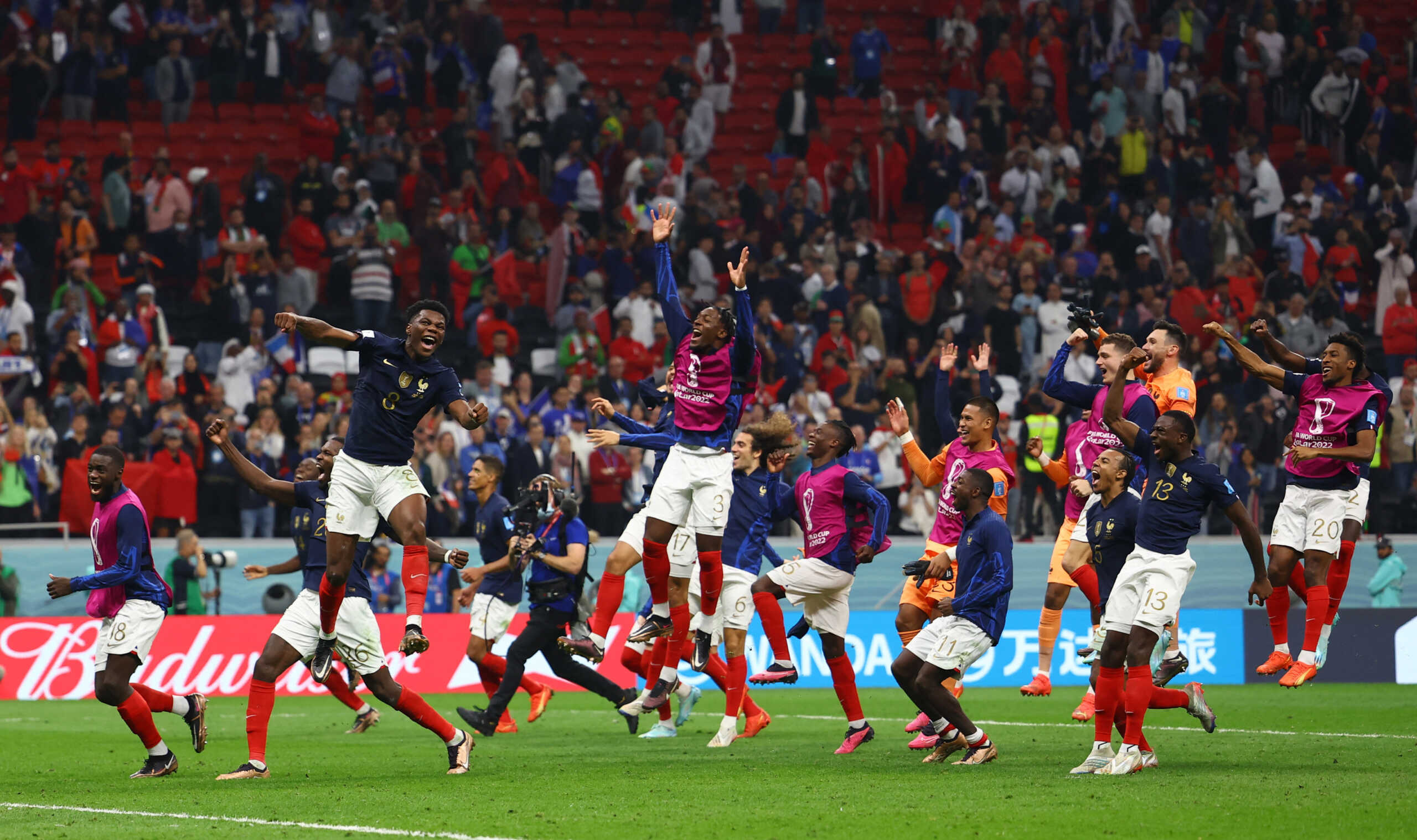 Soccer Football - FIFA World Cup Qatar 2022 - Semi Final - France v Morocco - Al Bayt Stadium, Al Khor, Qatar - December 14, 2022 France's Aurelien Tchouameni, Axel Disasi and teammates celebrate after the match as France reach the final REUTERS