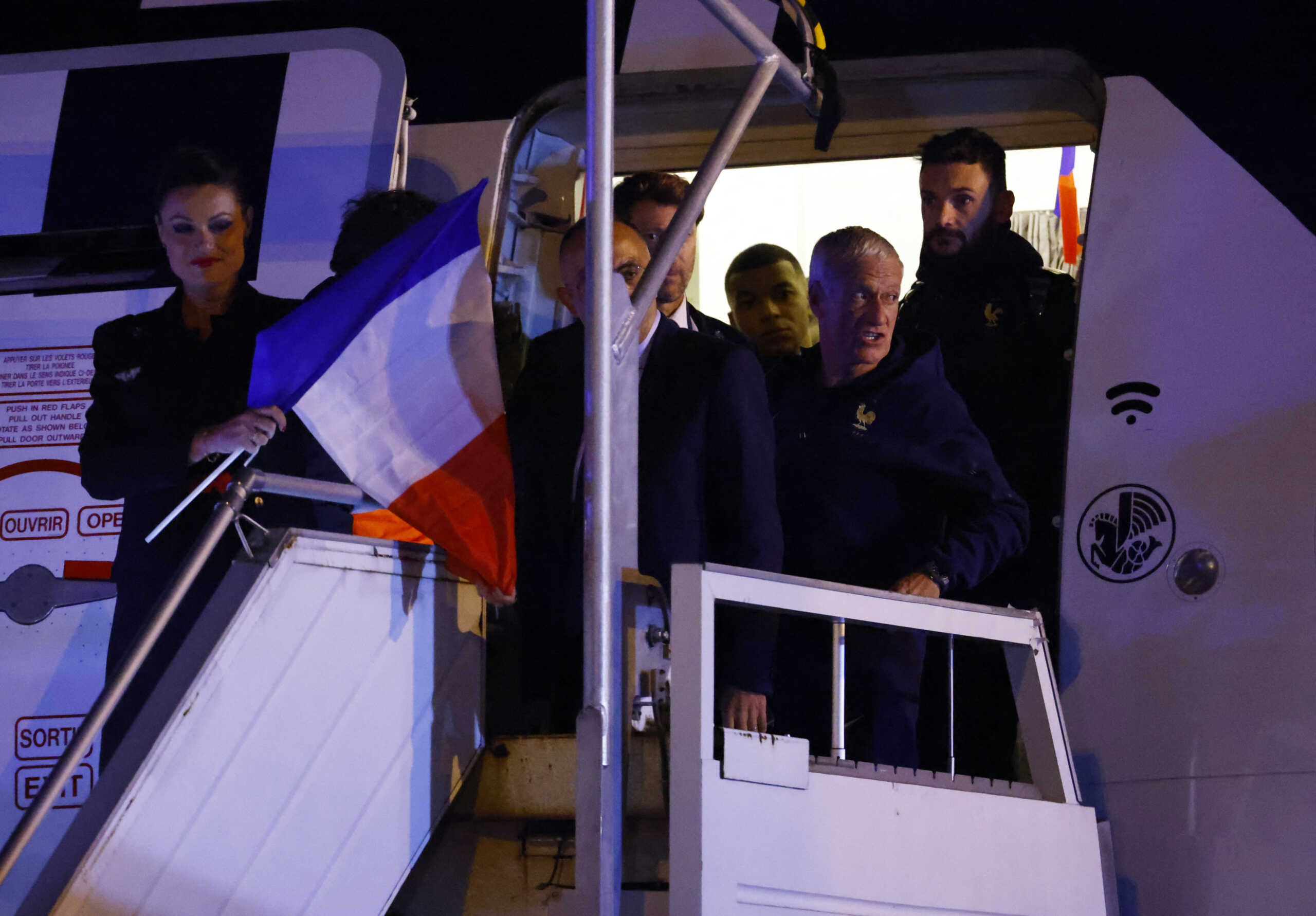 Soccer Football - FIFA World Cup Qatar 2022 - France arrive at Paris Charles de Gaulle Airport after losing in the World Cup Final against Argentina - Paris, France - December 19, 2022 France coach Didier Deschamps, Hugo Lloris and Kylian Mbappe arrive at Paris Charles de Gaulle Airport after losing in the World Cup Final against Argentina REUTERS