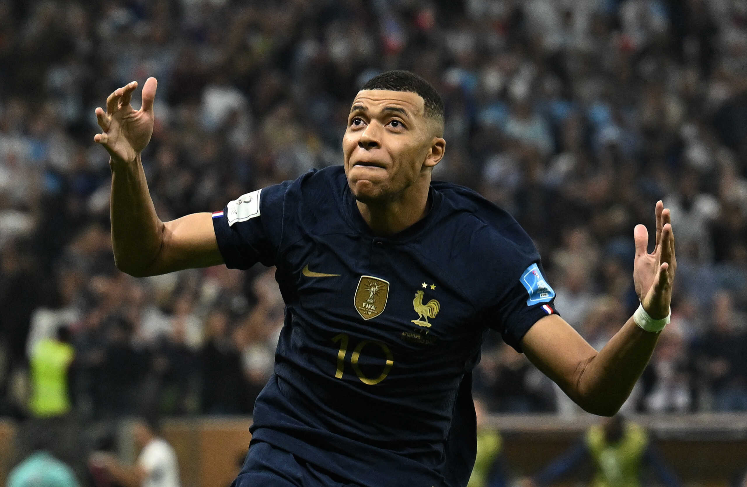 Soccer Football - FIFA World Cup Qatar 2022 - Final - Argentina v France - Lusail Stadium, Lusail, Qatar - December 18, 2022  France's Kylian Mbappe celebrates scoring their third goal to complete his hat-trick REUTERS