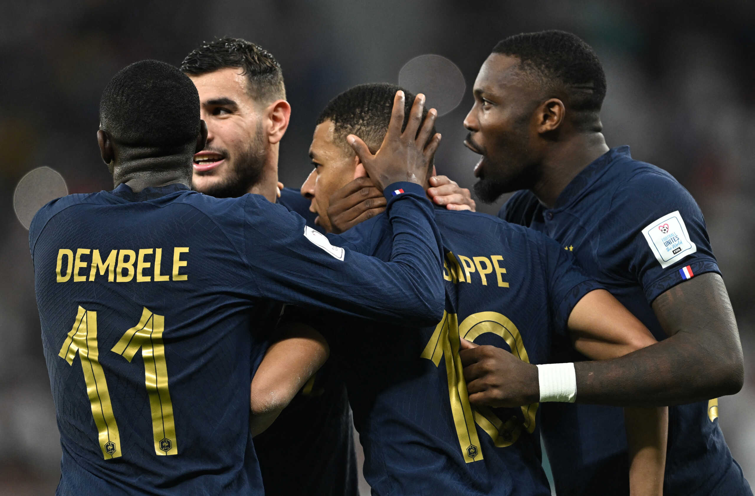 Soccer Football - FIFA World Cup Qatar 2022 - Round of 16 - France v Poland - Al Thumama Stadium, Doha, Qatar - December 4, 2022 France's Kylian Mbappe celebrates scoring their second goal with teammates REUTERS