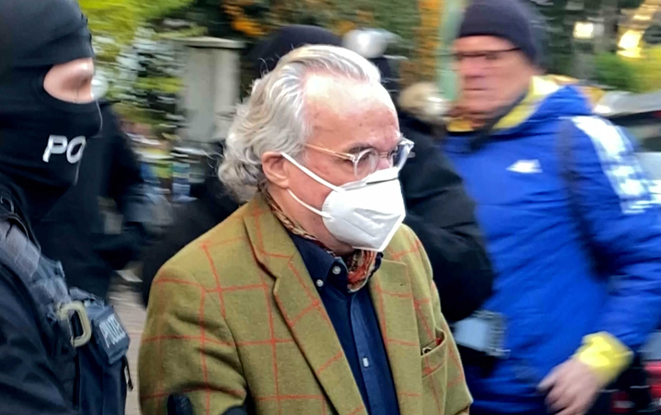 Police escorts Prince Heinrich XIII P. R. in this screen grab from Reuters TV, after 25 suspected members and supporters of a far-right group were detained during raids across Germany, in Frankfurt, Germany December 7, 2022.  Tilman Blasshofer