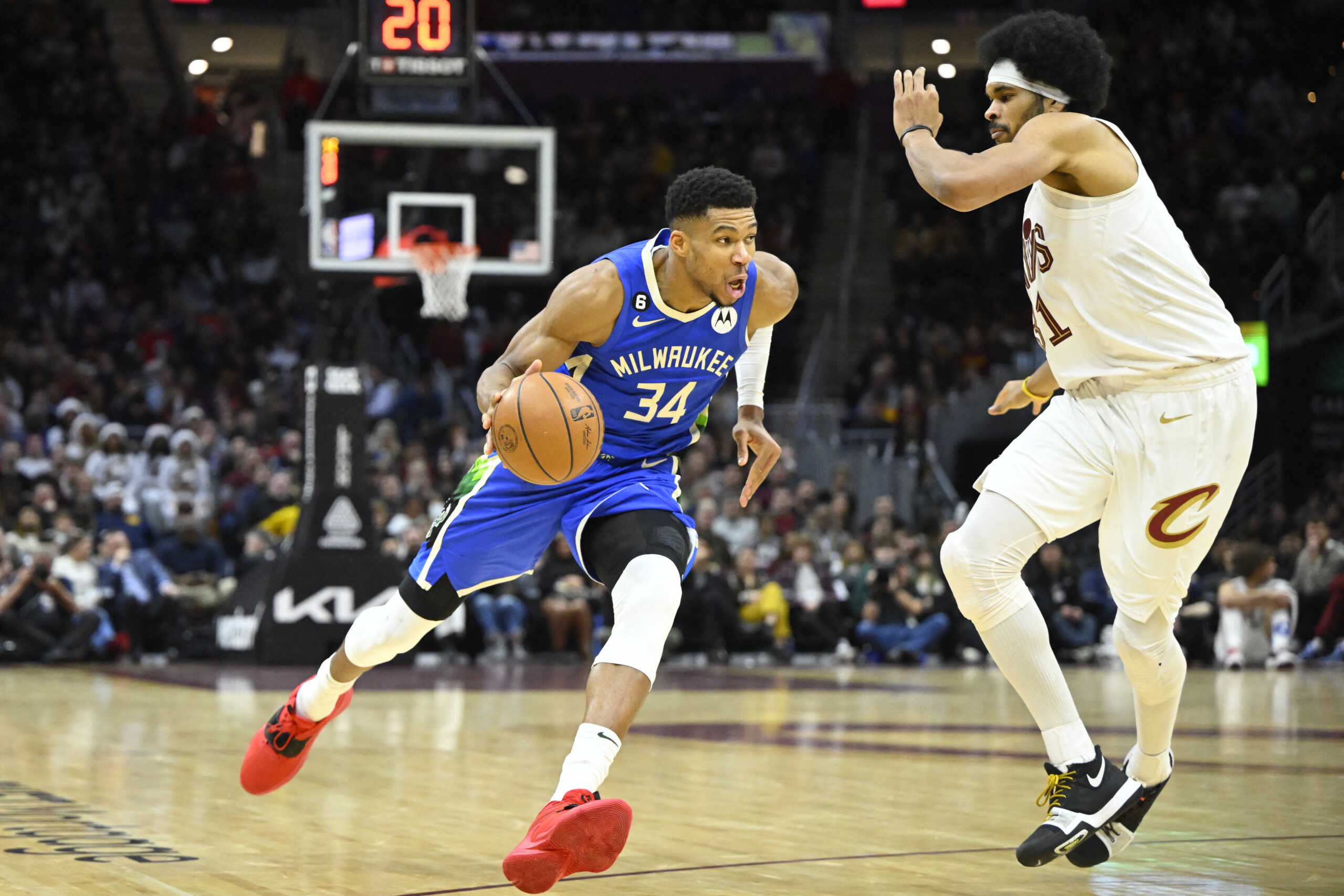 Dec 21, 2022; Cleveland, Ohio, USA; Milwaukee Bucks forward Giannis Antetokounmpo (34) drives against Cleveland Cavaliers center Jarrett Allen (31) in the fourth quarter at Rocket Mortgage FieldHouse. Mandatory Credit: David Richard-USA TODAY Sports