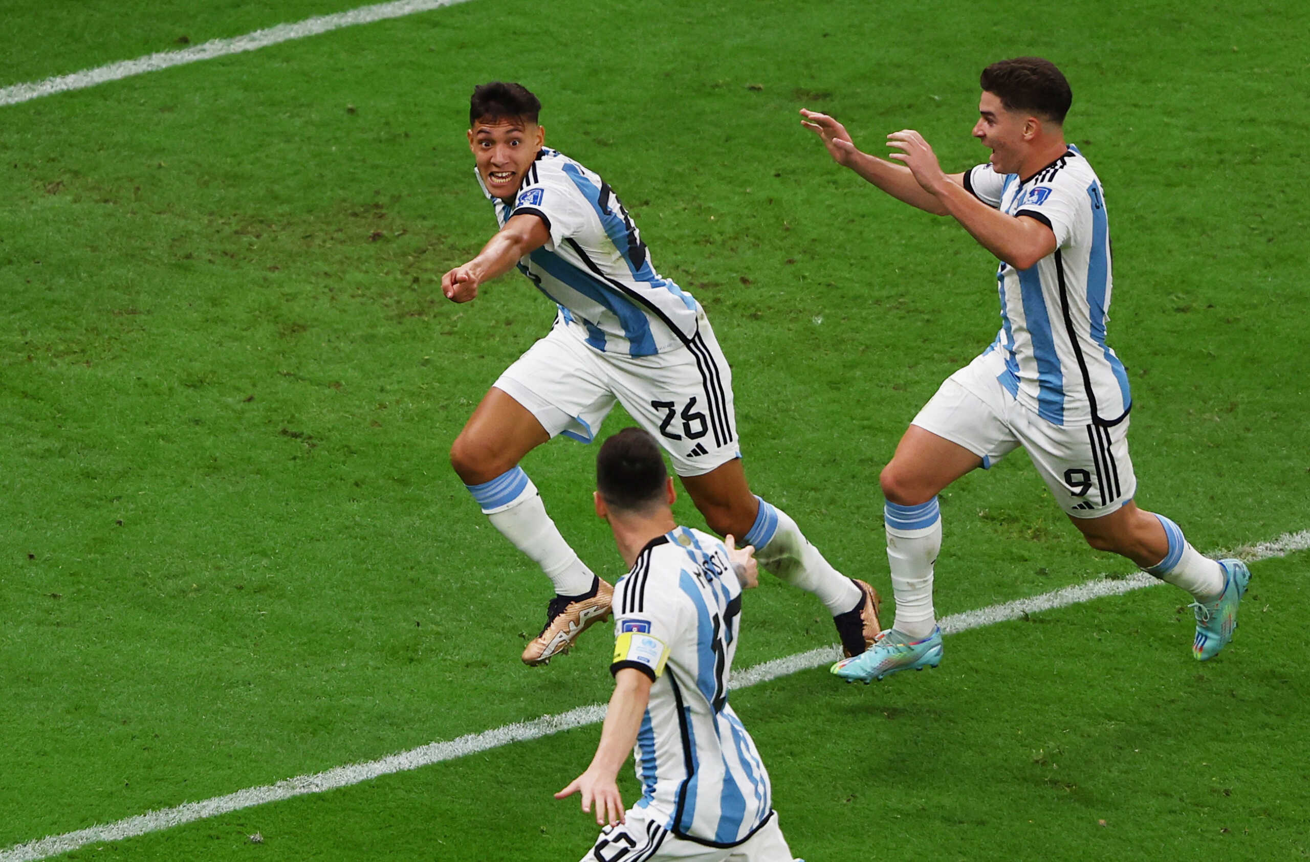 Soccer Football - FIFA World Cup Qatar 2022 - Quarter Final - Netherlands v Argentina - Lusail Stadium, Lusail, Qatar - December 9, 2022  Argentina's Nahuel Molina celebrates scoring their first goal with Lionel Messi and Julian Alvarez REUTERS