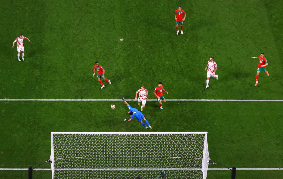 Soccer Football - FIFA World Cup Qatar 2022 - Third-Place Playoff - Croatia v Morocco - Khalifa International Stadium, Doha, Qatar - December 17, 2022 Croatia's Mislav Orsic scores their second goal past Morocco's Yassine Bounou REUTERS
