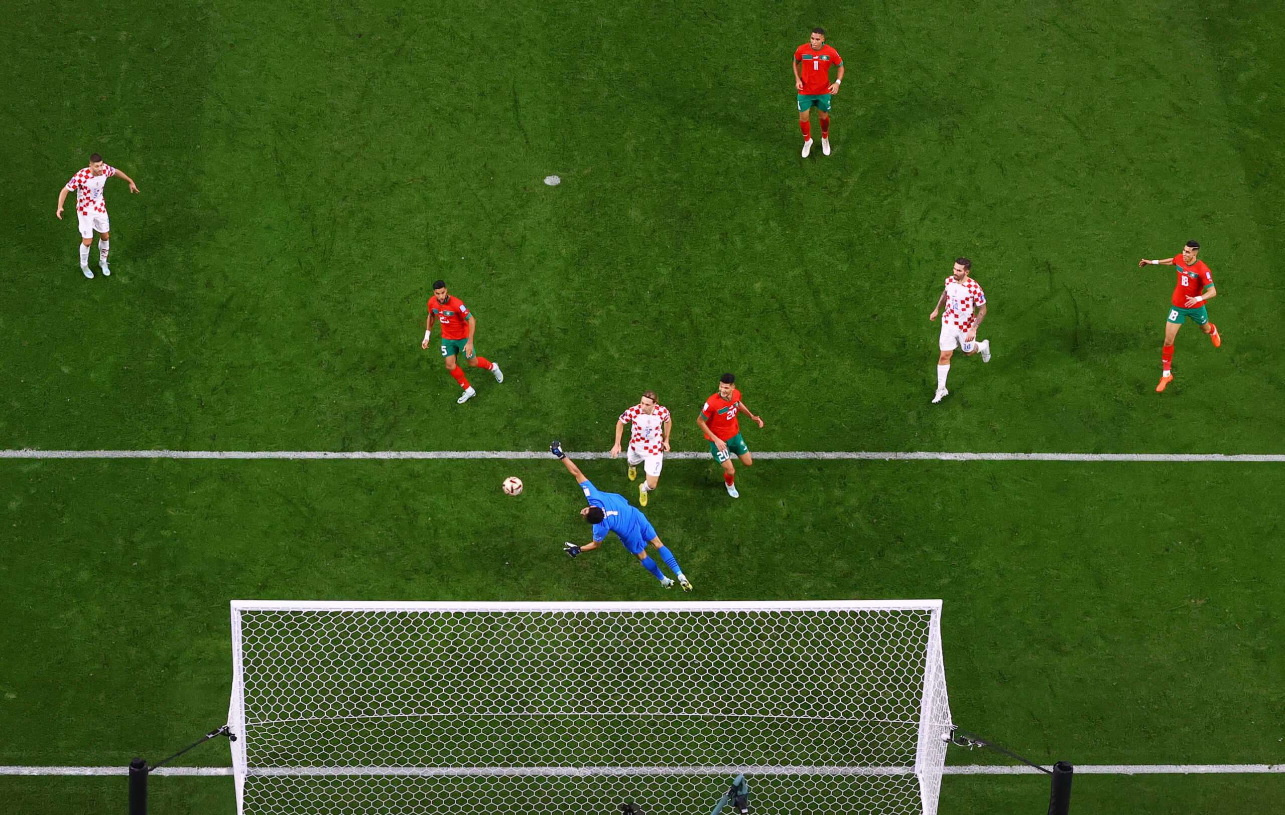 Soccer Football - FIFA World Cup Qatar 2022 - Third-Place Playoff - Croatia v Morocco - Khalifa International Stadium, Doha, Qatar - December 17, 2022 Croatia's Mislav Orsic scores their second goal past Morocco's Yassine Bounou REUTERS