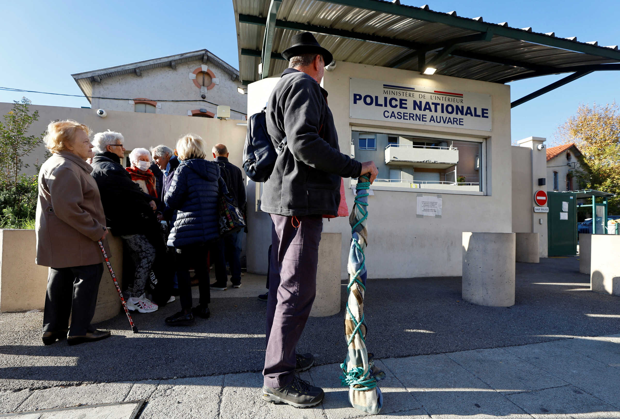 Residents queue to drop off their undeclared firearms at a police station in Nice as part of an unprecedented collection campaign organised by French authorities to reduce the number of illegally-held weapons in France, November 30, 2022.   REUTERS