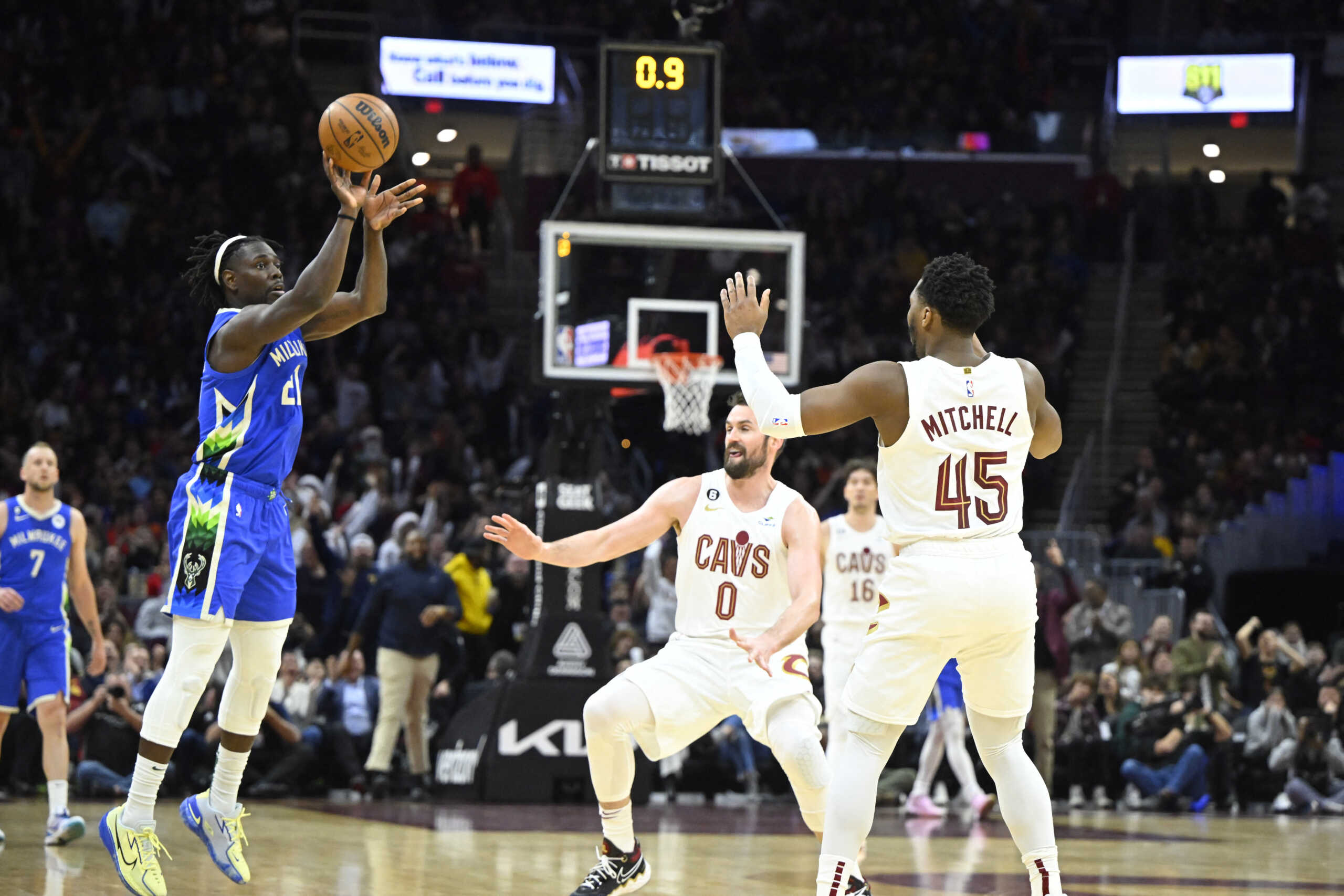 Dec 21, 2022; Cleveland, Ohio, USA; Milwaukee Bucks guard Jrue Holiday (21) shoots a three-point basket in the third quarter against the Cleveland Cavaliers at Rocket Mortgage FieldHouse. Mandatory Credit: David Richard-USA TODAY Sports