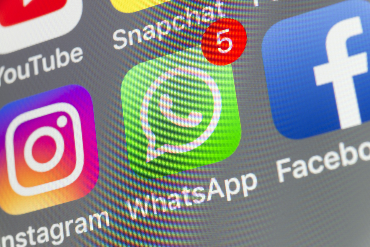 London, UK - August 02, 2018: The buttons of WhatsApp, Facebook, Instagram, Snapchat and Youtube on the screen of an iPhone.