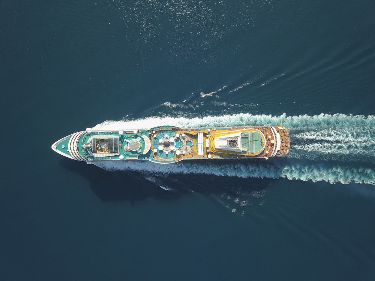 Aerial view large cruise ship at sea, Passenger cruise ship vessel, sailing across the Ksamil, Albania. View from drone.