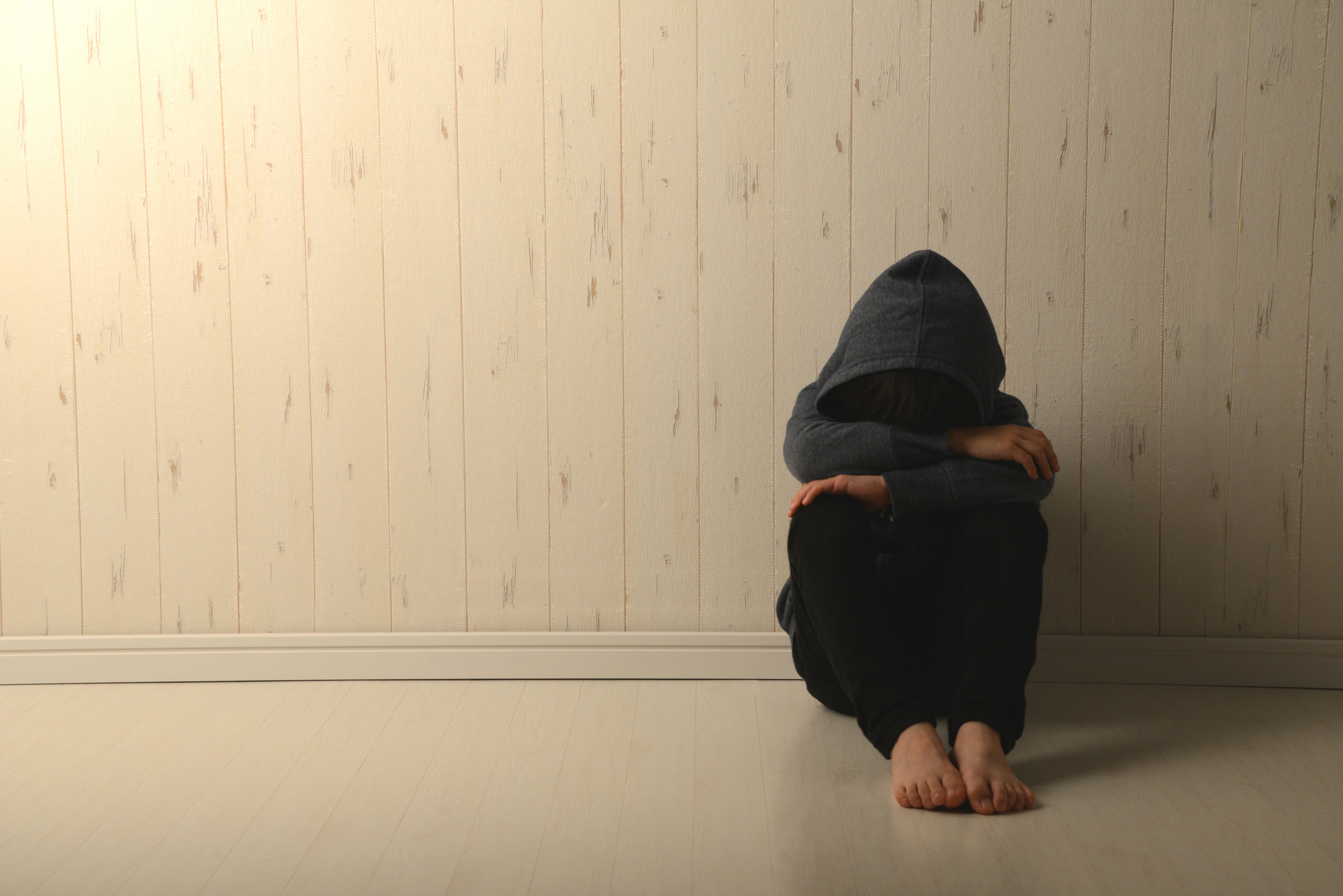 Suffering child in dark room